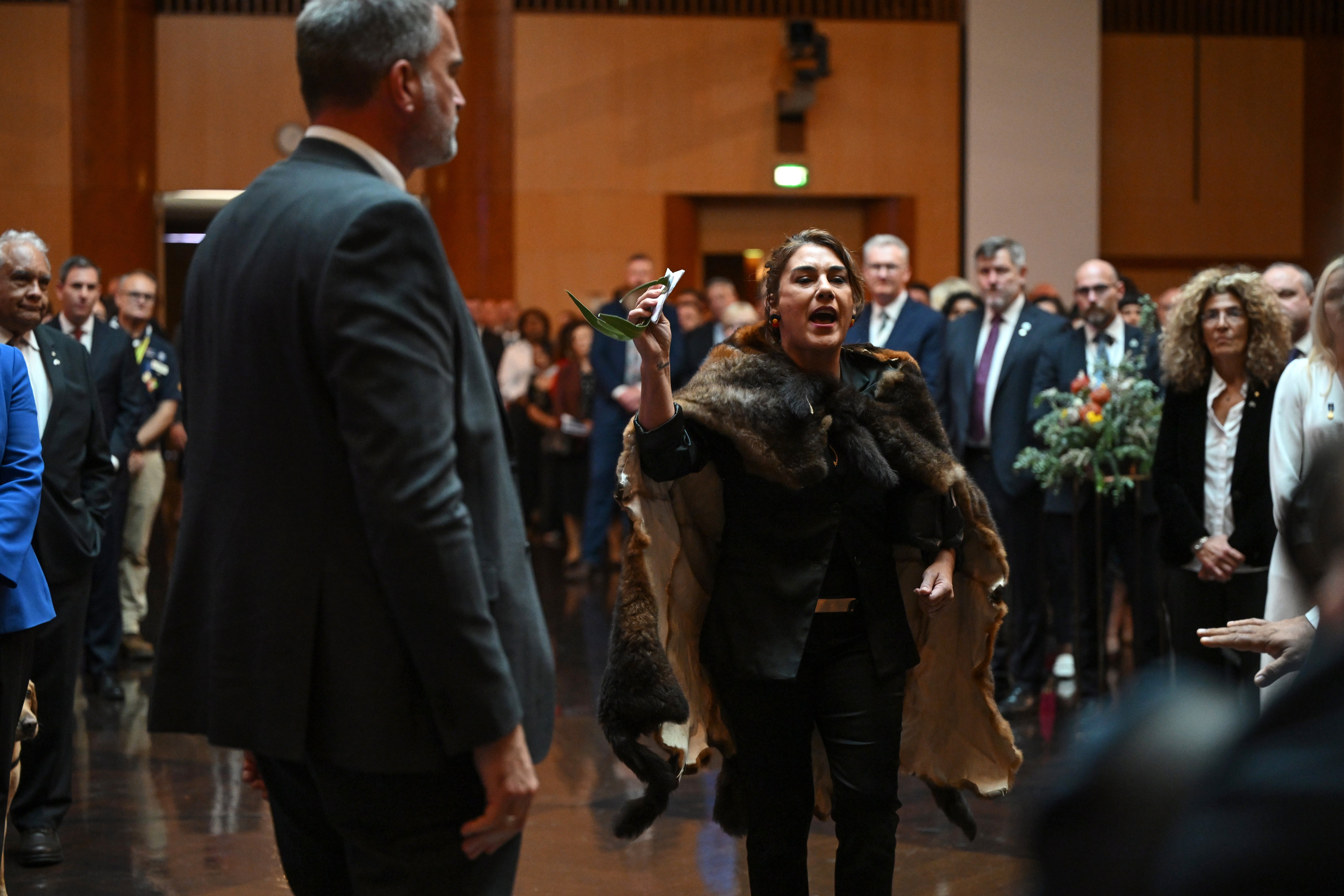 Australian senator Lidia Thorpe protests during the ceremonial welcome in Canberra for the King and Queen (Victoria Jones/PA)