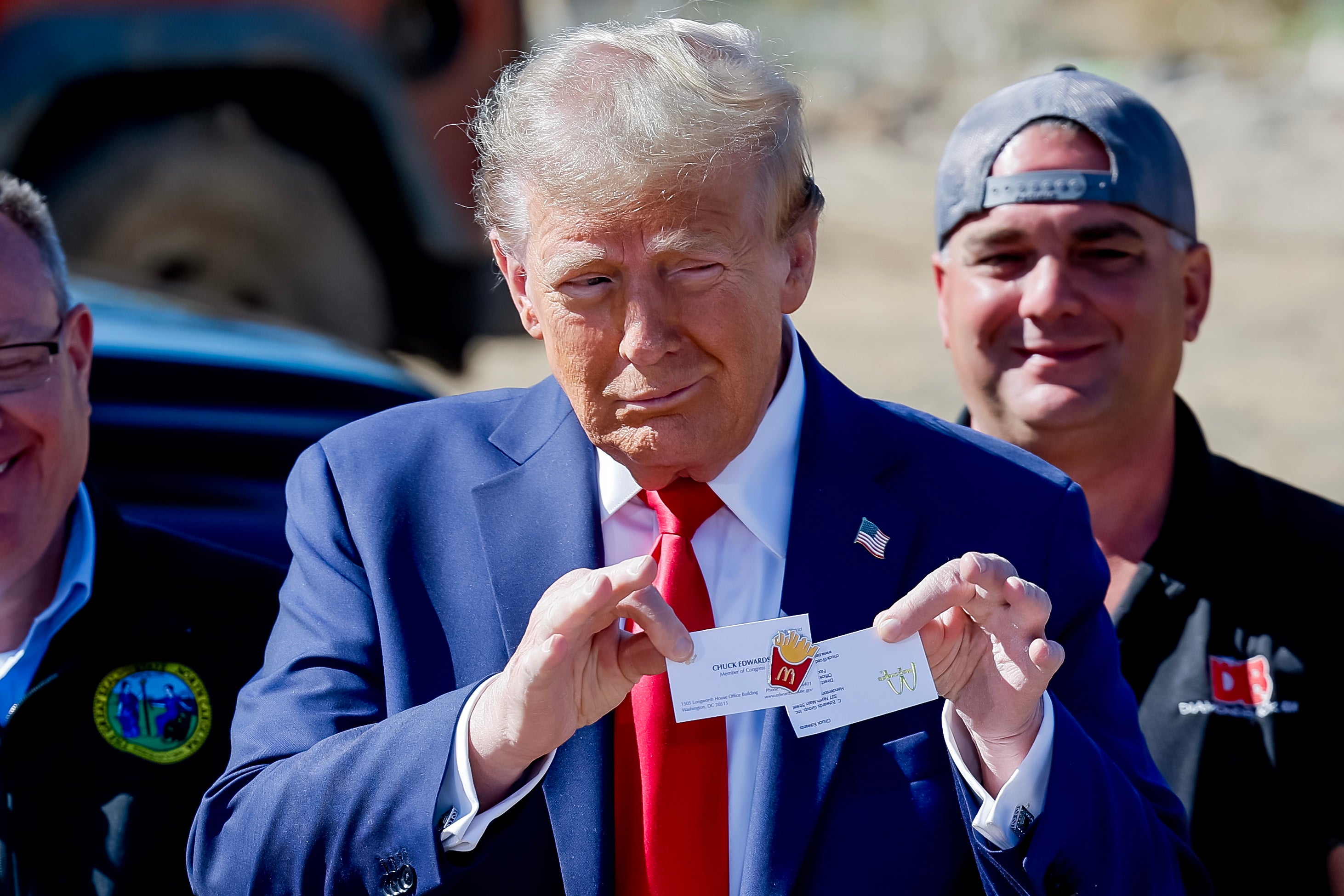 Former US president and Republican presidential nominee Donald Trump holds an official McDonald’s fries cook pin given to him during a tour of Hurricane Helene’s devastation in Swannanoa, North Carolina, USA, 21 October 2024