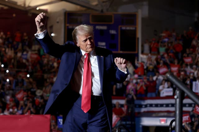 <p>Donald Trump dances onstage at his rally at East Carolina University in Greenville, North Carolina</p>