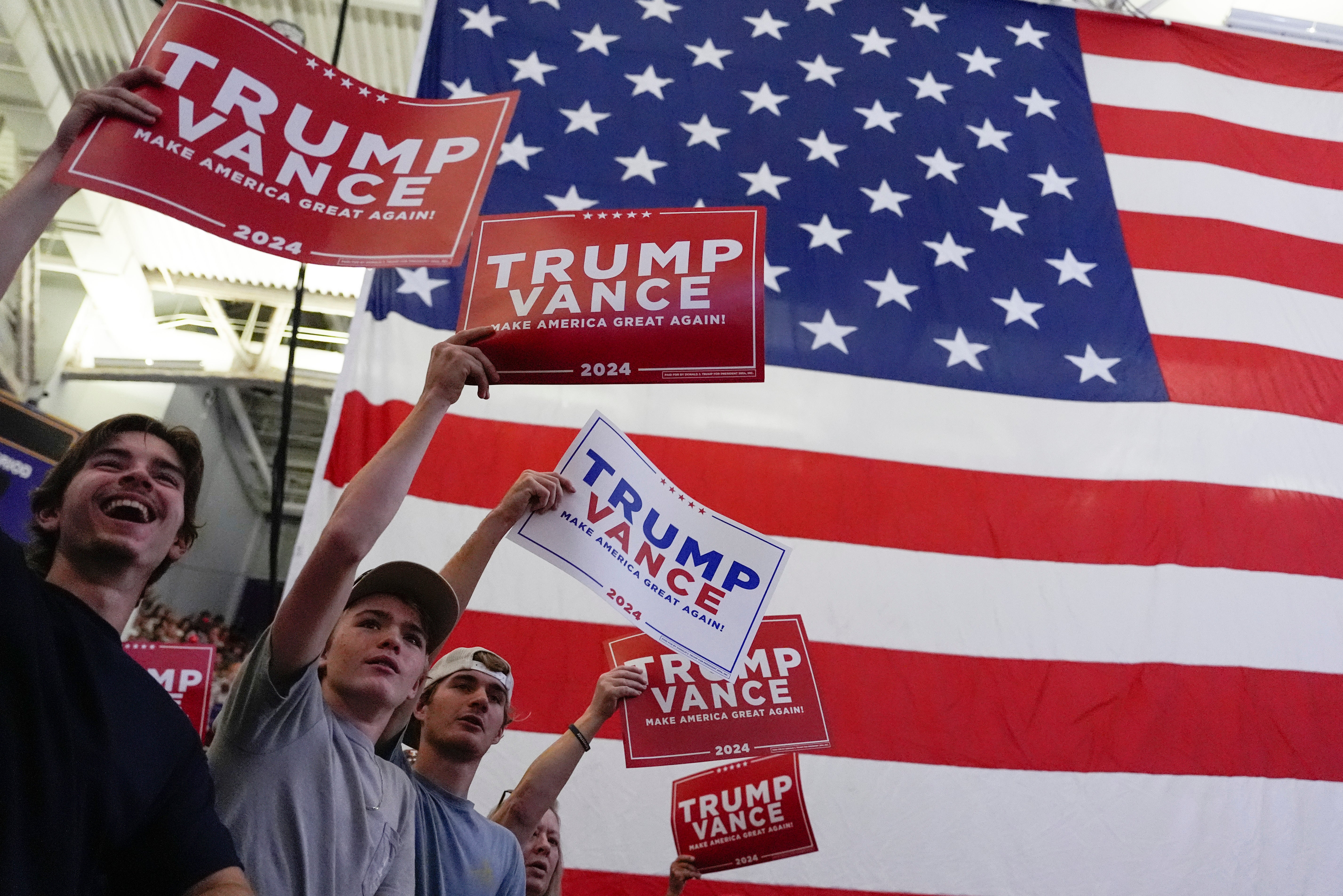 Supporters listen as Republican presidential candidate former President Donald Trump speaks at a campaign rally at Minges Coliseum Monday, Oct. 21, 2024, in Greenville, North Carolina.