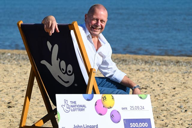 IT worker John Lingard is celebrating winning £500,000 on the lottery a year after having cancer surgery (National Lottery/PA)