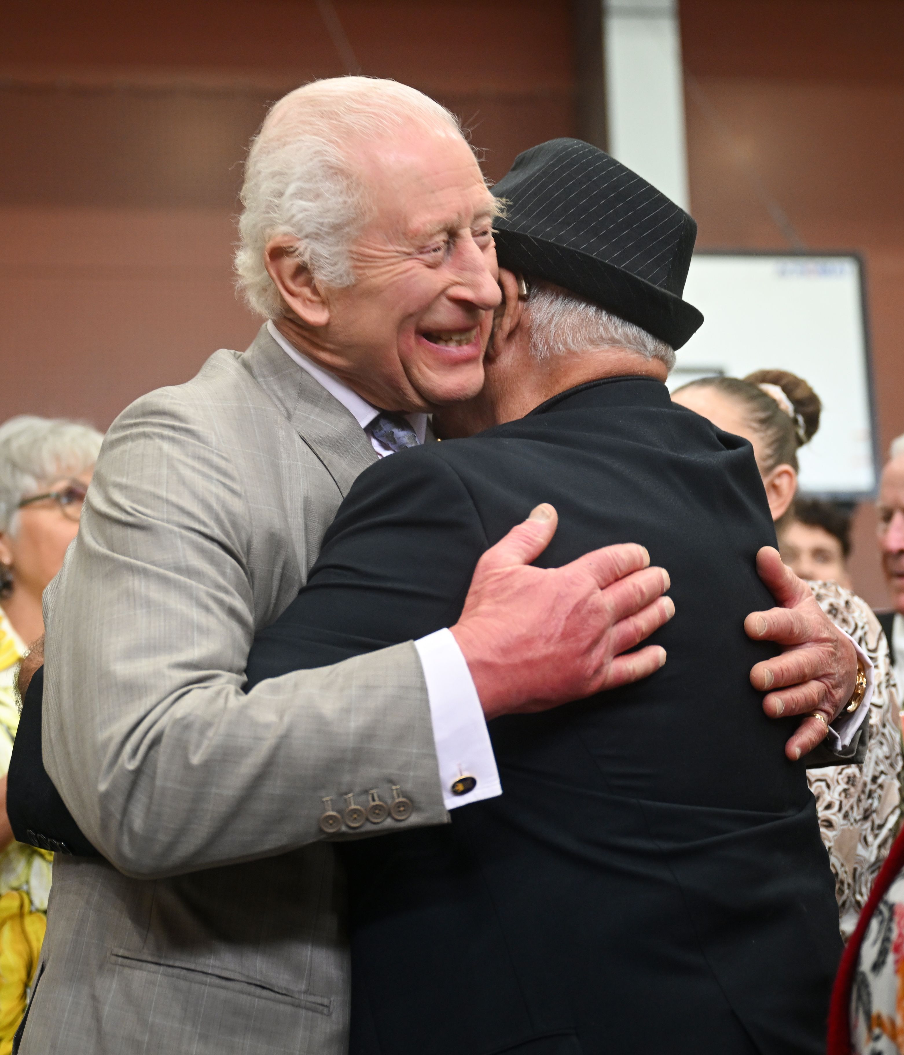 King Charles hugs Uncle James Michael 'Widdy' Welsh.