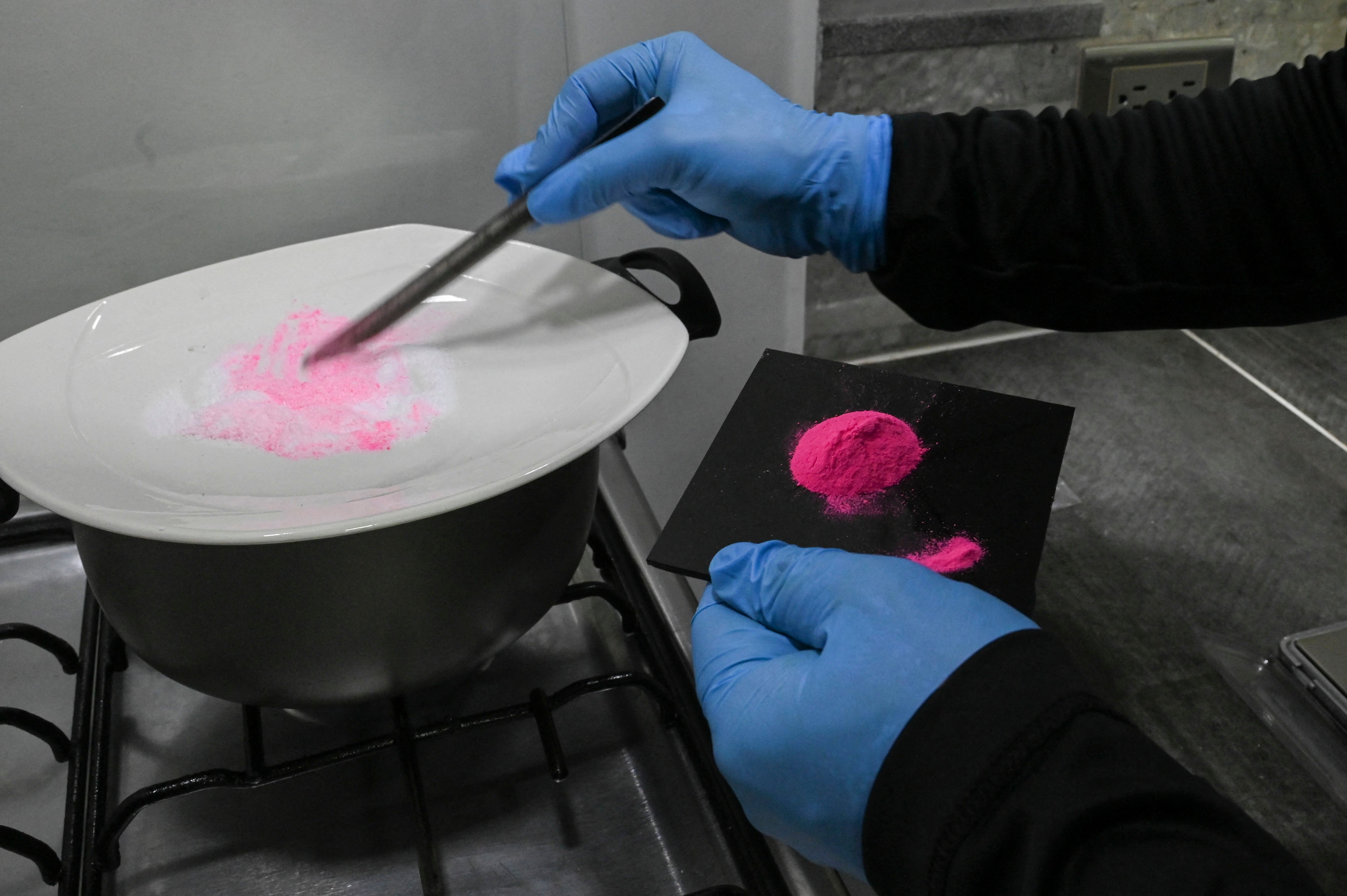 A man prepares pink cocaine in Colombia in April 2022