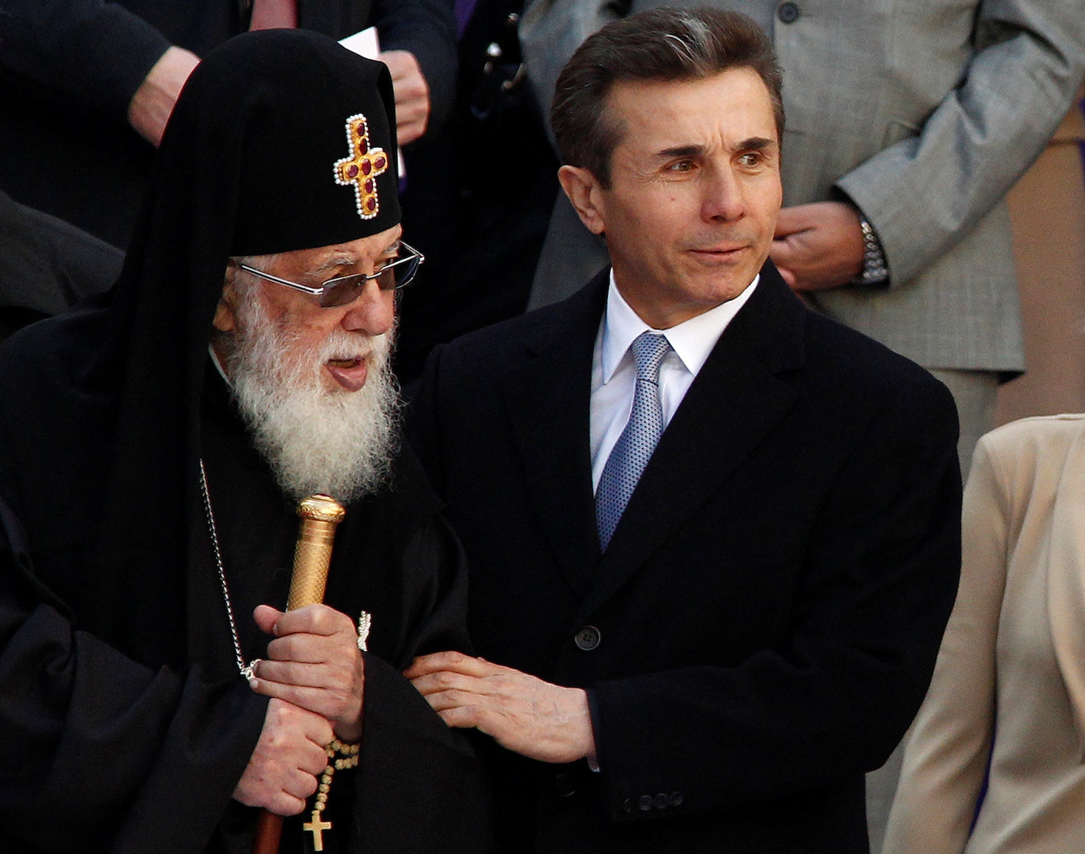 Ivanishvili, right, and Patriarch Ilia II attend the inauguration ceremony of newly elected Georgian president in 2013