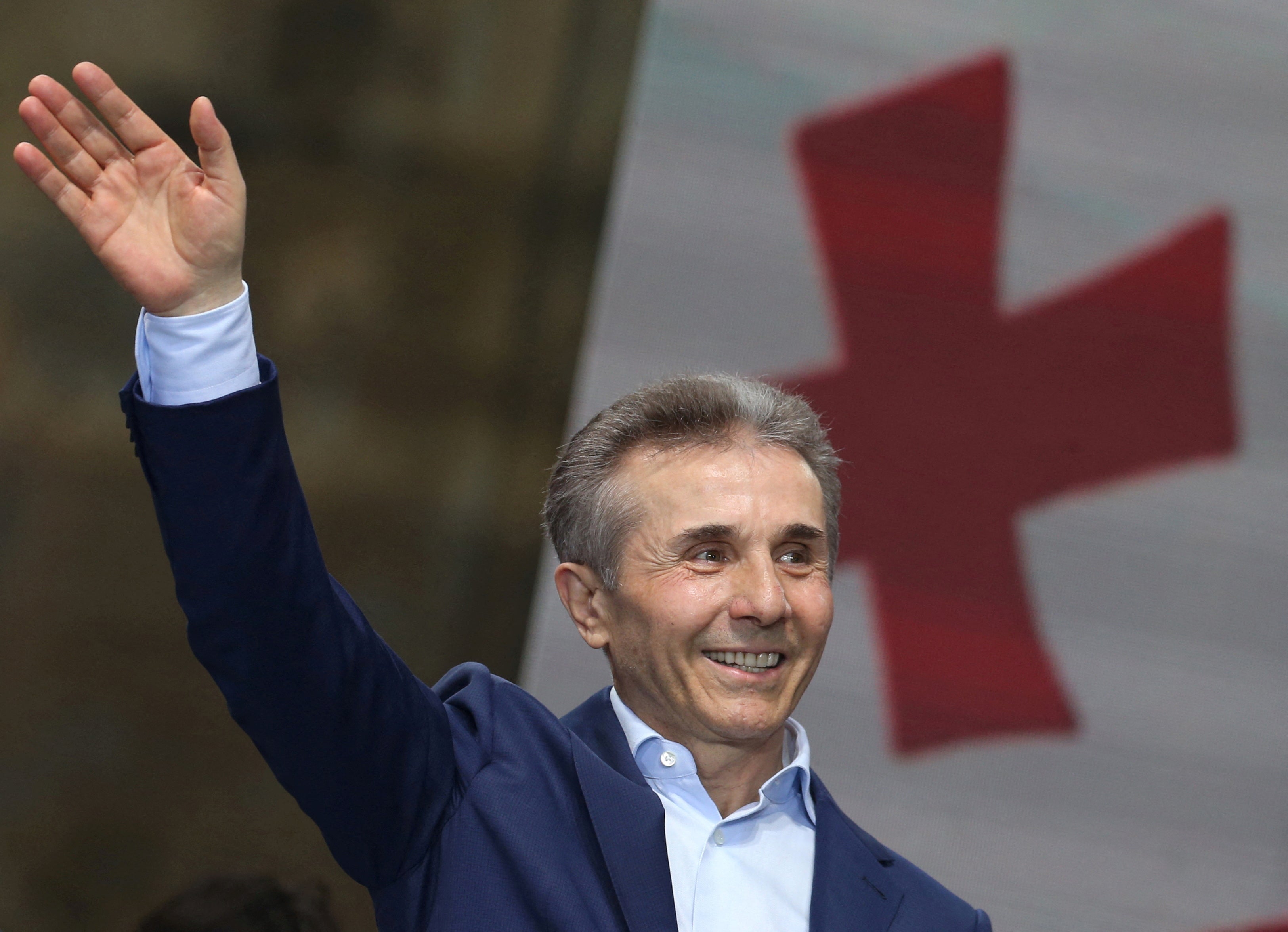 Bidzina Ivanishvili, former prime minister and founder of the Georgian Dream party, waves during a pro-government rally
