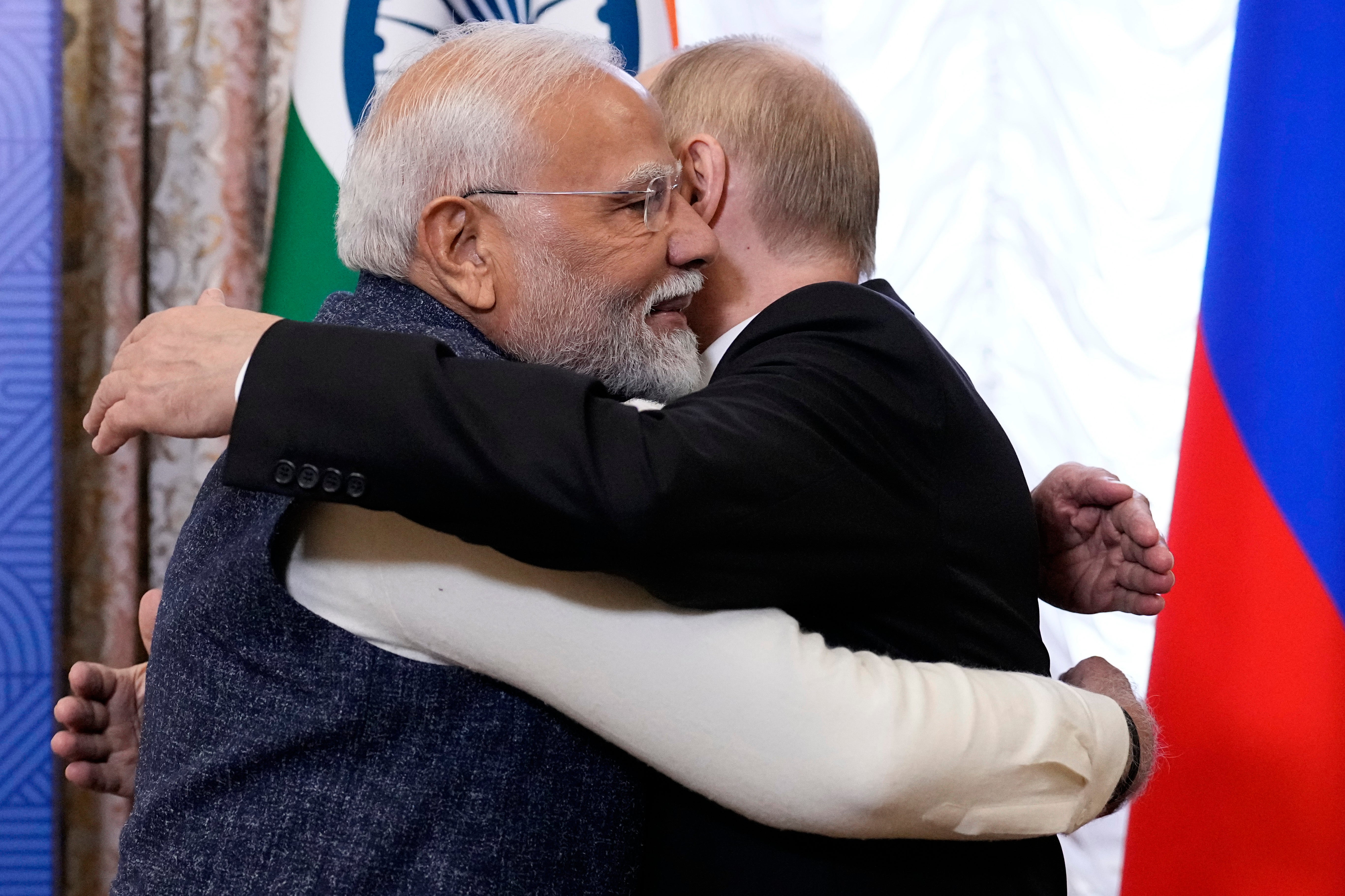 Russian President Vladimir Putin (R) embraces Indian Prime Minister Narendra Modi during their meeting on the sidelines of BRICS Summit at Kazan Kremlin in Kazan, Russia, 22 October 2024