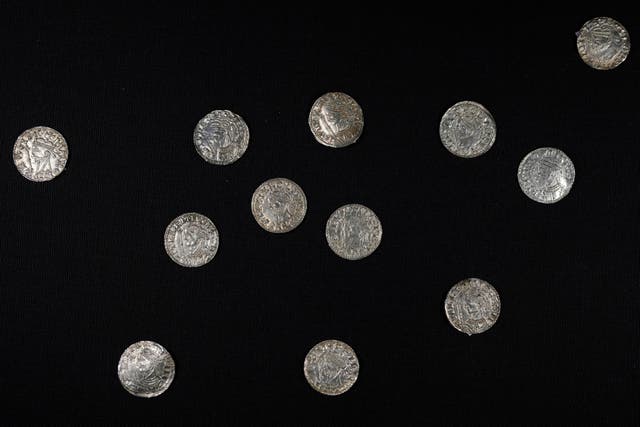 Metal detectorist Adam Staples discovered 2,584 coins depicting William the Conqueror and Harold II in Somerset in 2019 (Alastair Grant/AP)