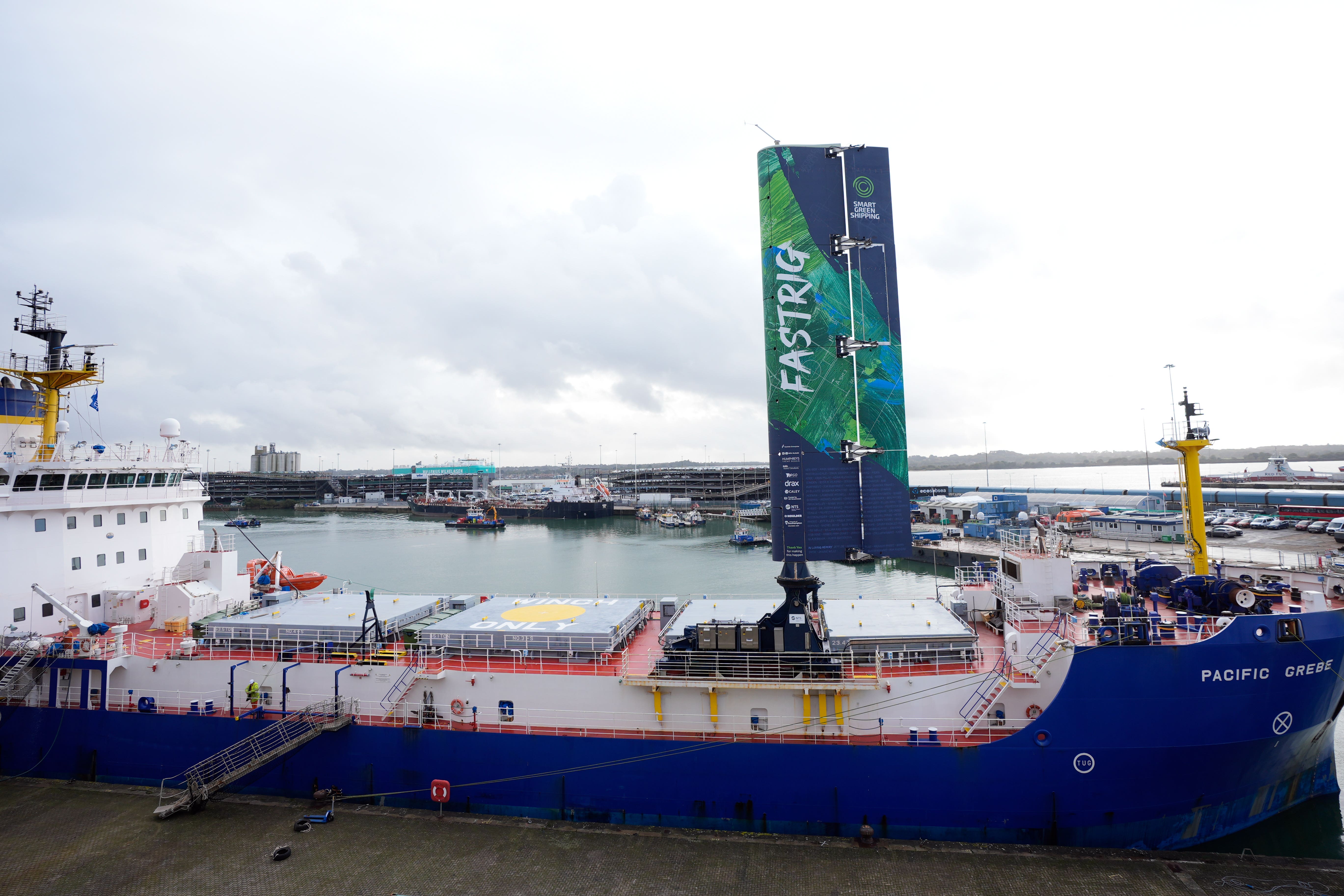 A FastRig test sail developed by Smart Green Shipping, after being lifted into position on the Pacific Grebe, after docking in Southampton for sea trials (Andrew Matthews/PA)