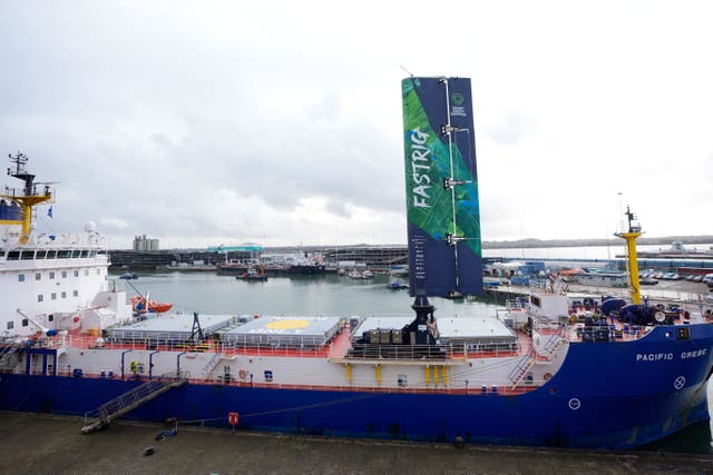 A FastRig test sail developed by Smart Green Shipping, after being lifted into position on the Pacific Grebe, after docking in Southampton for sea trials (Andrew Matthews/PA)