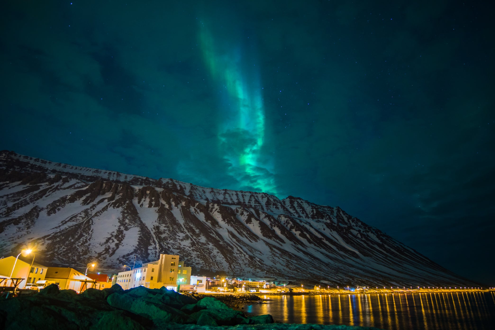 The Northern Lights commanding the sky over the Troll Seat and Ísafjörður