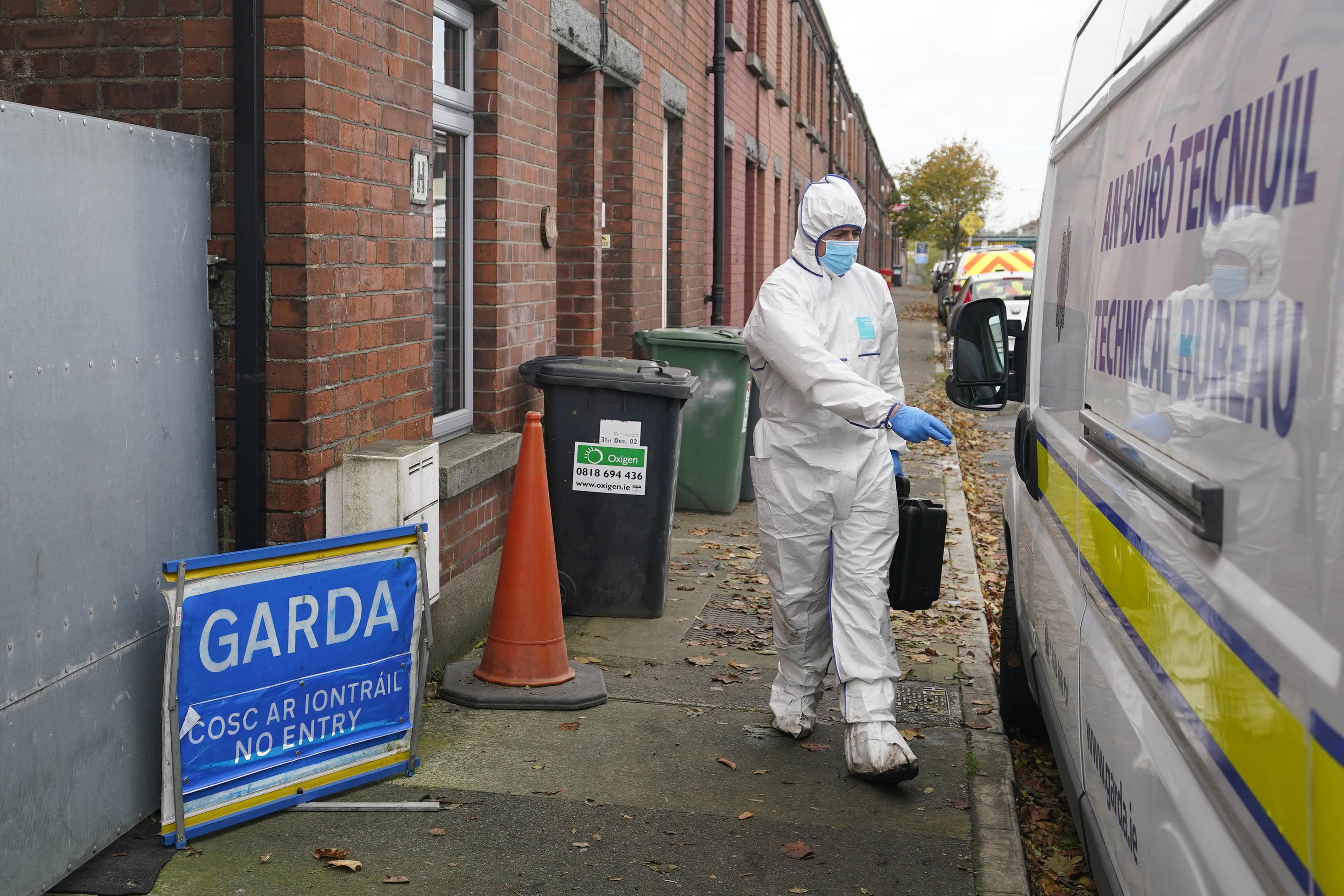 Gardai forensic officers at a house in Dundalk, Co Louth as they search a former family home, in the investigation into the suspected murder of eight-year-old Kyran Durnin (Niall Carson/PA)