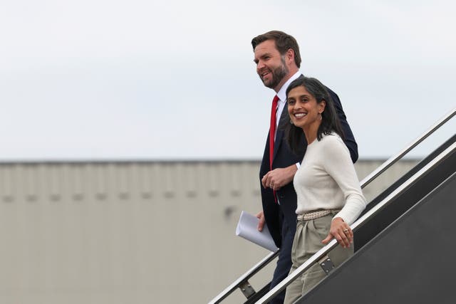 <p>JD Vance and Usha Vance step off an airplane in Minneapolis on October 14. Usha revealed she carries a copy of ‘The Iliad’ on the campaign trail because their seven-year-old son is ‘obsessed’ with Greek mythology</p>