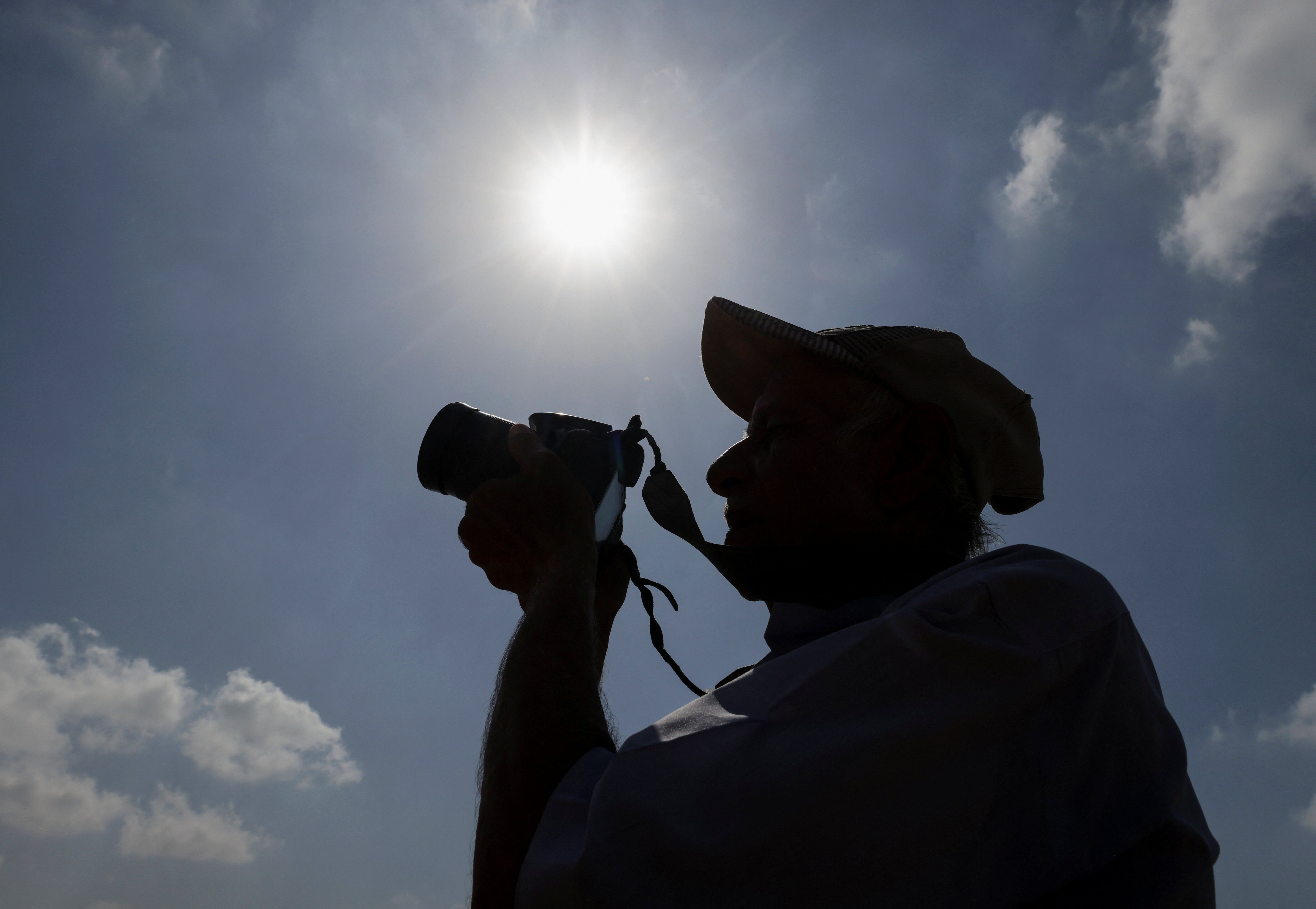 Khaled Abdel Rahman, 74, takes a photo during a hot day at a public beach near the entrance of the Egypt’s Suez Cana last month. September broke a 15-month streak of new records. Despite the streak ending, experts still expect 2024 to be the hottest year on record