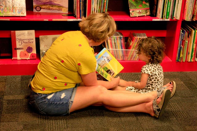 A survey of around 2,000 UK parents of children aged 0-5 found only 50.5% said they had read with their young child at least once a day in the past week (Alamy/PA)