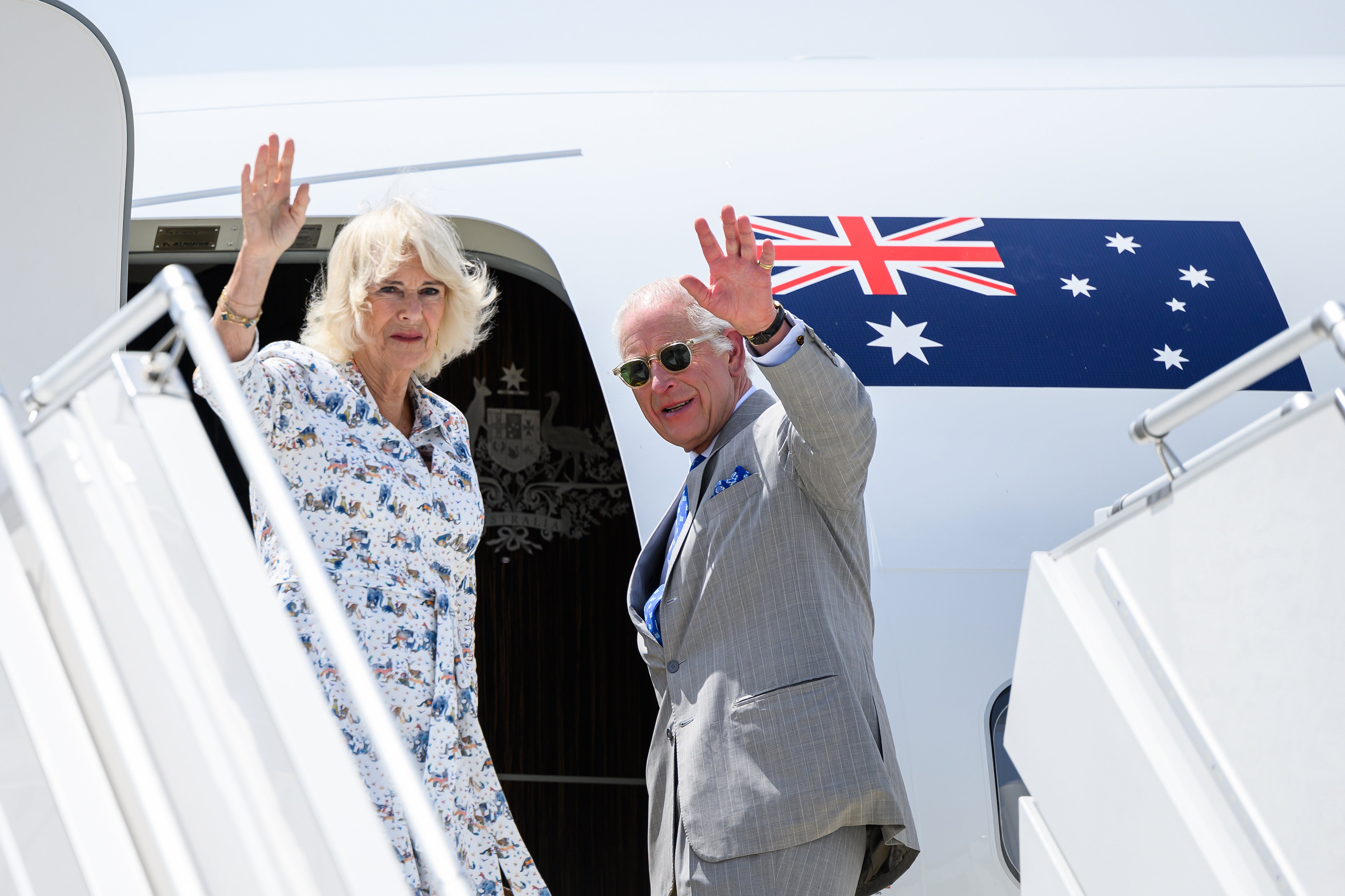 King Charles and Queen Camilla wave as they depart from the Kingsford Smith Airport in Sydney, Australia, on 23 October