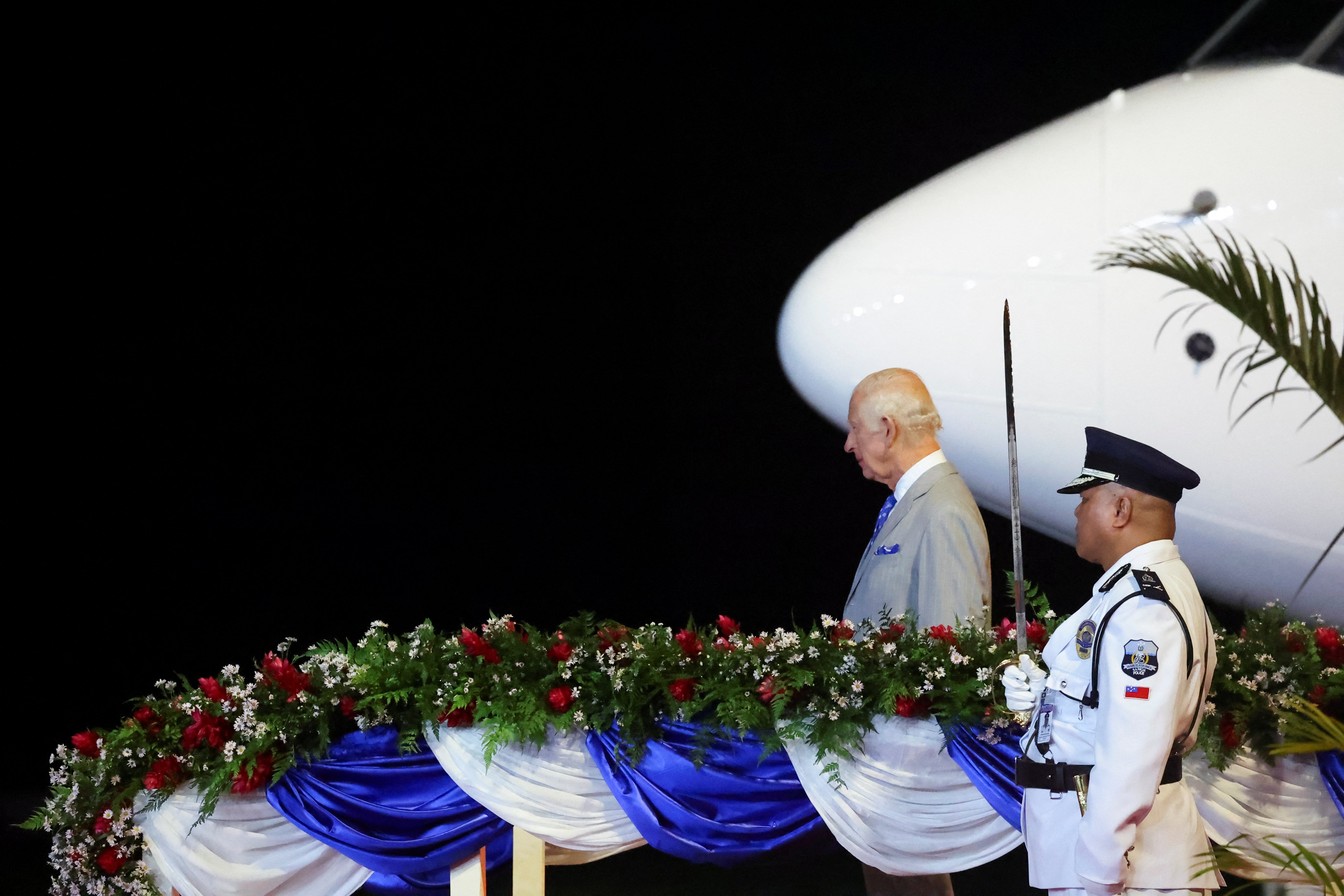 Britain’s King Charles looks on as he arrives at Faleolo International Airport, in Faleolo, Samoa on 23 October 2024