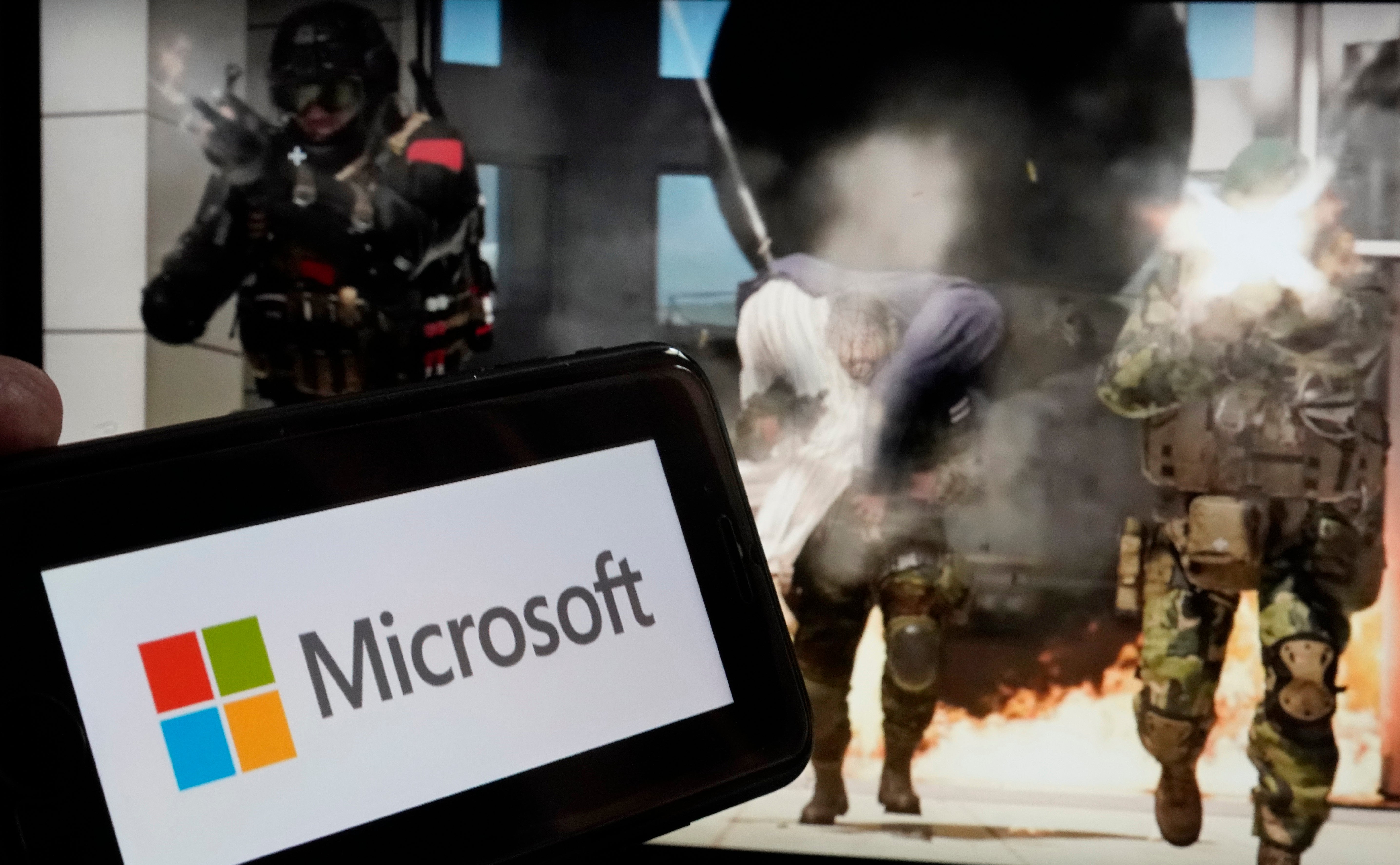 The logo for Microsoft, and a scene from Activision "Call of Duty - Modern Warfare