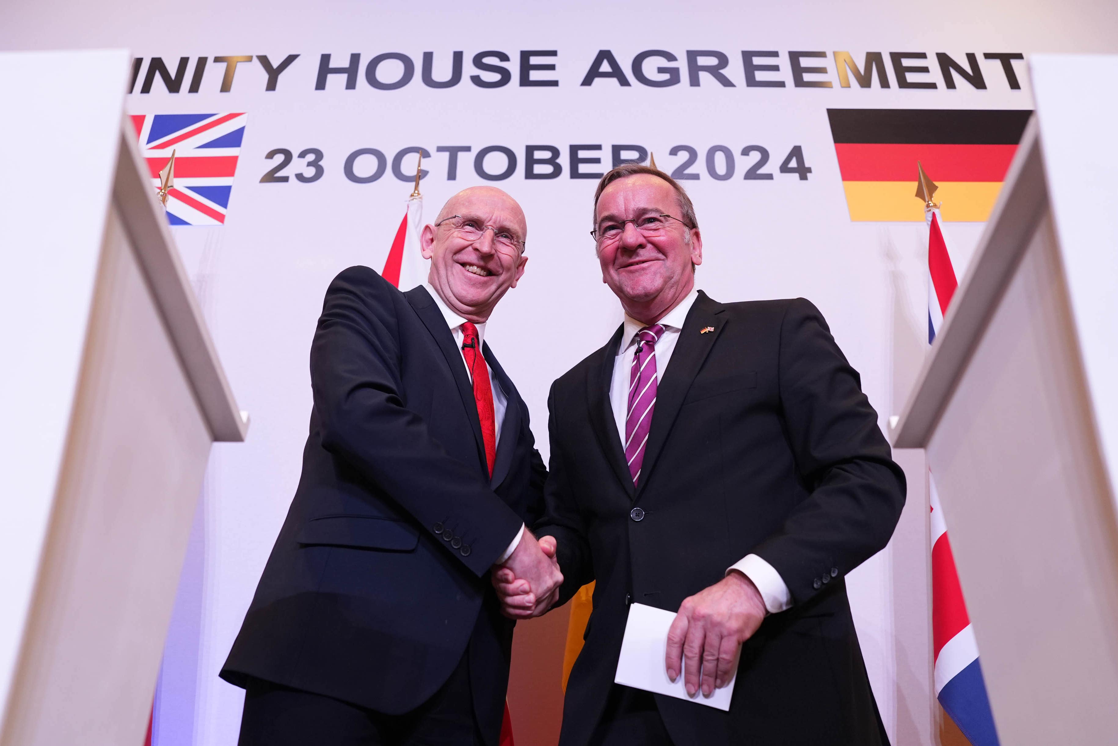 Defence Secretary John Healey, left, and his German counterpart, Boris Pistorius, at a press conference after signing the deal (Jordan Pettitt/PA)