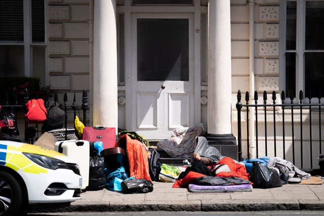 <p>A view of the scene outside the Comfort Inn hotel on Belgrave Road in Pimlico, central London, where the Home Office have reportedly asked a group of refugees to be accommodated four to a room</p>