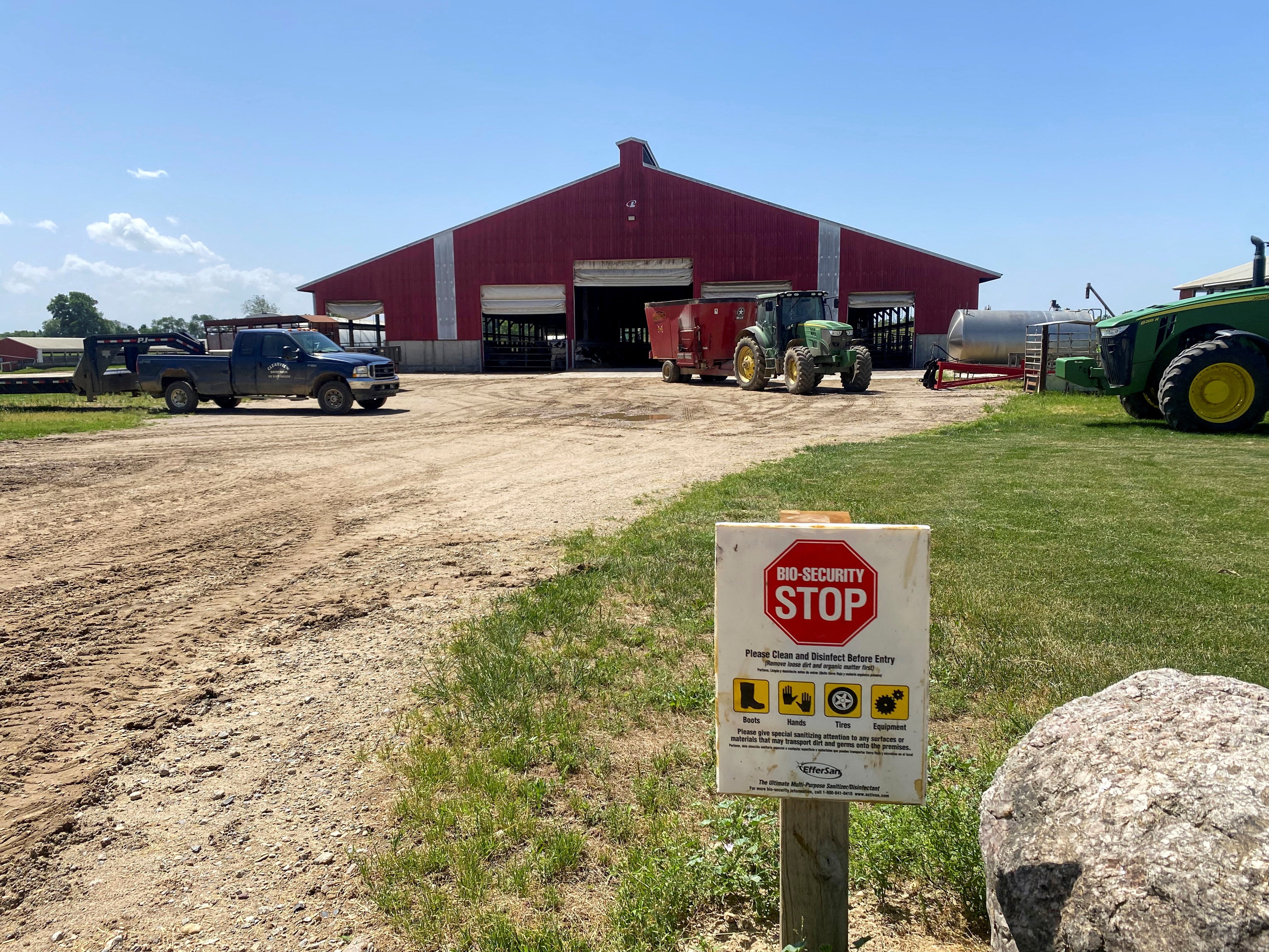 A warning sign stands at a dairy farm in Martin, Michigan, last June. Michigan officials announced the state’s first outbreak since early September last week. Human cases of bird flu are now in six states