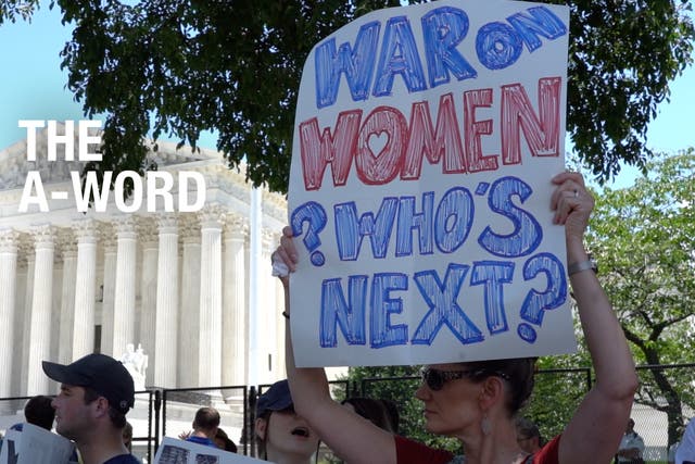 <p>People protesting outside of the Capitol building in DC. A woman holds up a  sign that reads: ‘War on women. Who’s next?’</p>