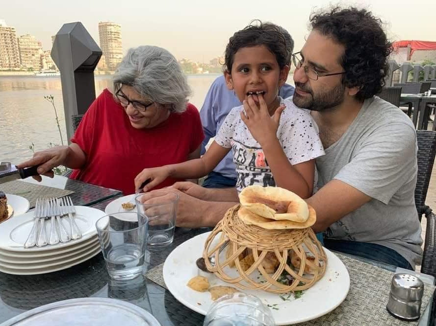 Laila celebrates her 63rd birthday alongise her son Alaa and her grandson Khaled in Cairo, Egypt, in May 2019, months before Mr Fattah was arrested again