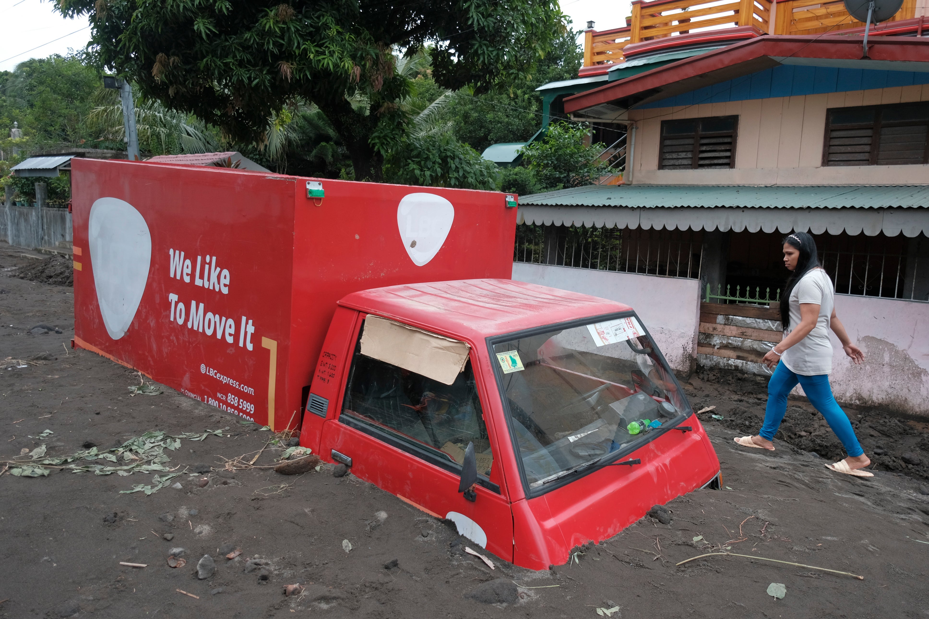 Truck is buried in volcanic mud that flowed down from the Mayon volcano after heavy rains caused by Trami hit Guinobatan town in Albay province, Philippines, on 23 October 2024