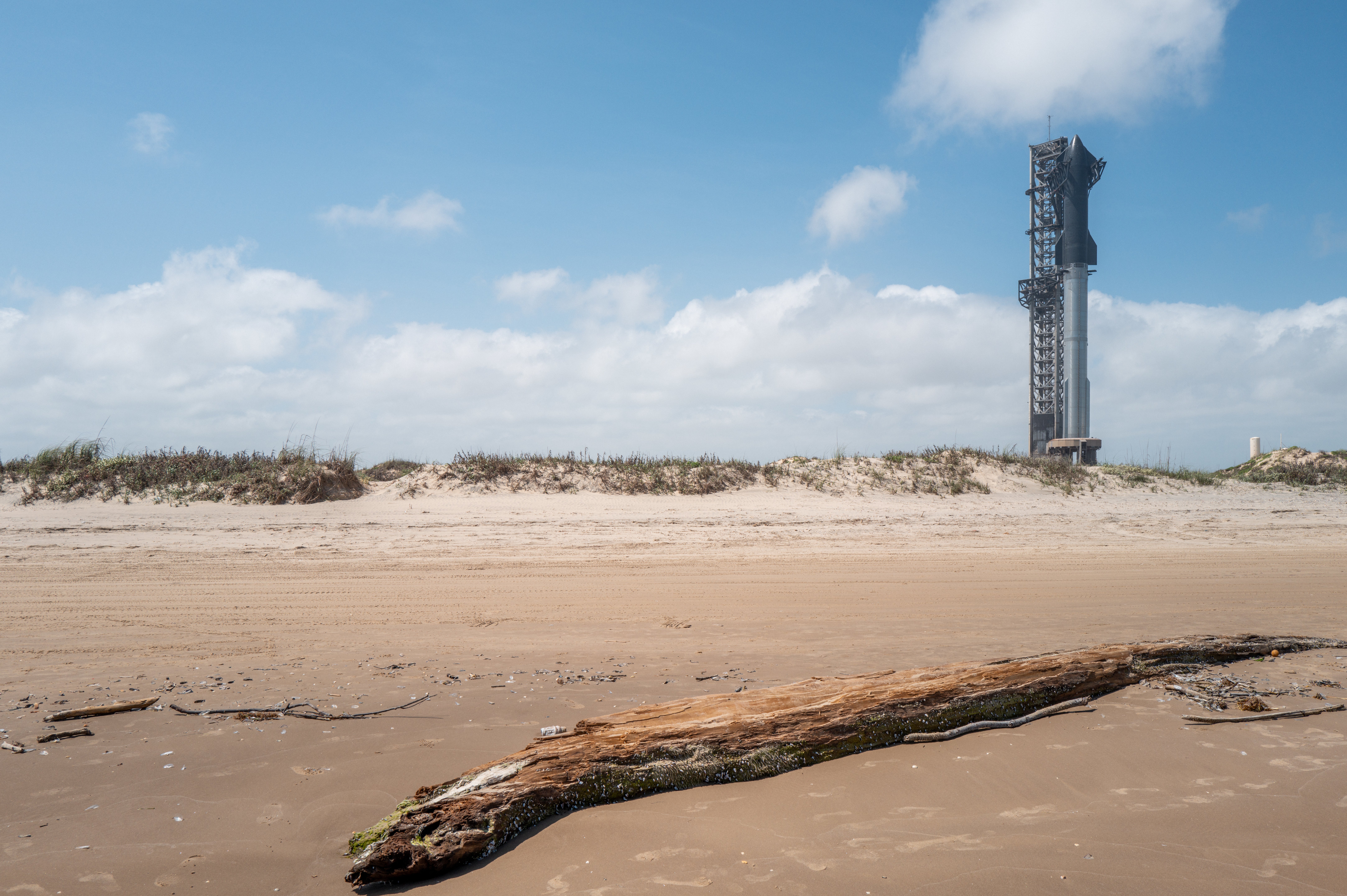 A SpaceX Starship Flight 3 Rocket sits near Boca Chica Beach, where the company has a launch area. SpaceX employee Kevin Edward Escobar died after swimming at the same beach on Sunday