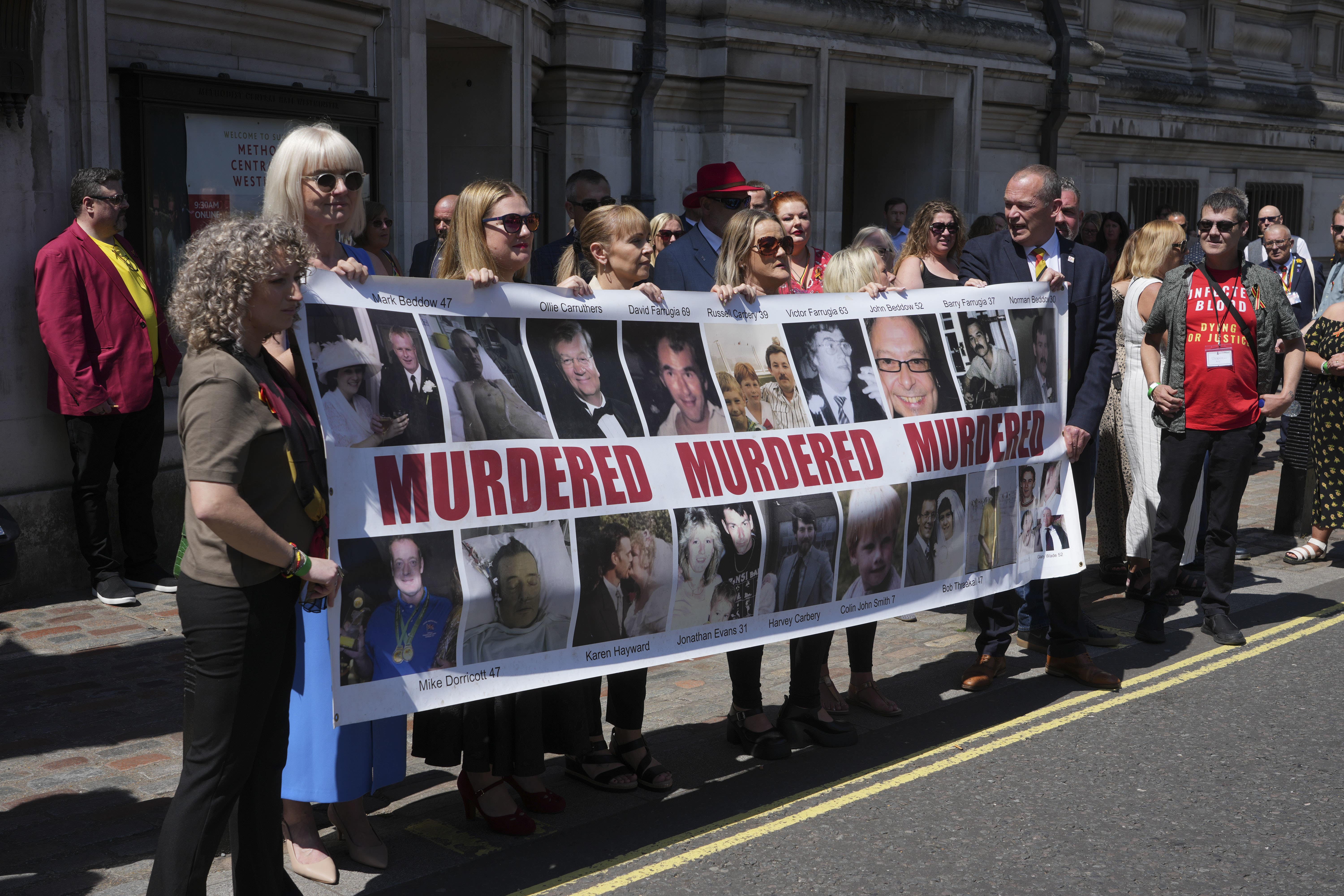 Victims and campaigners of the infected blood scandal outside Central Hall in Westminster (Jeff Moore/PA)