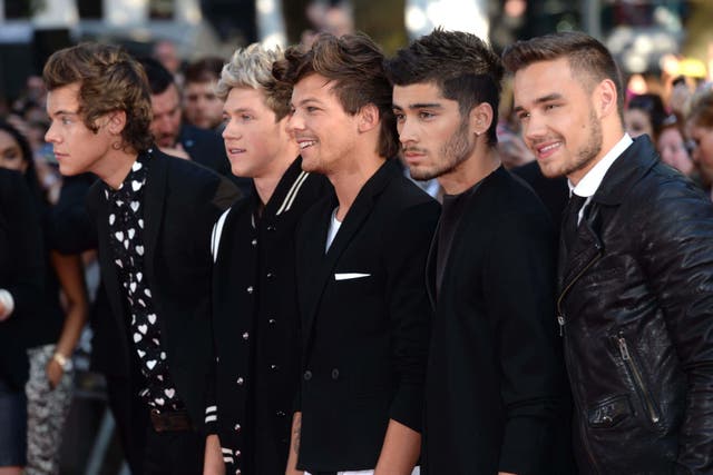 Zayn Malik, second right next to Payne, right, has described the loss of his former bandmate as ‘heartbreaking’ (Doug Peters/Alamy)