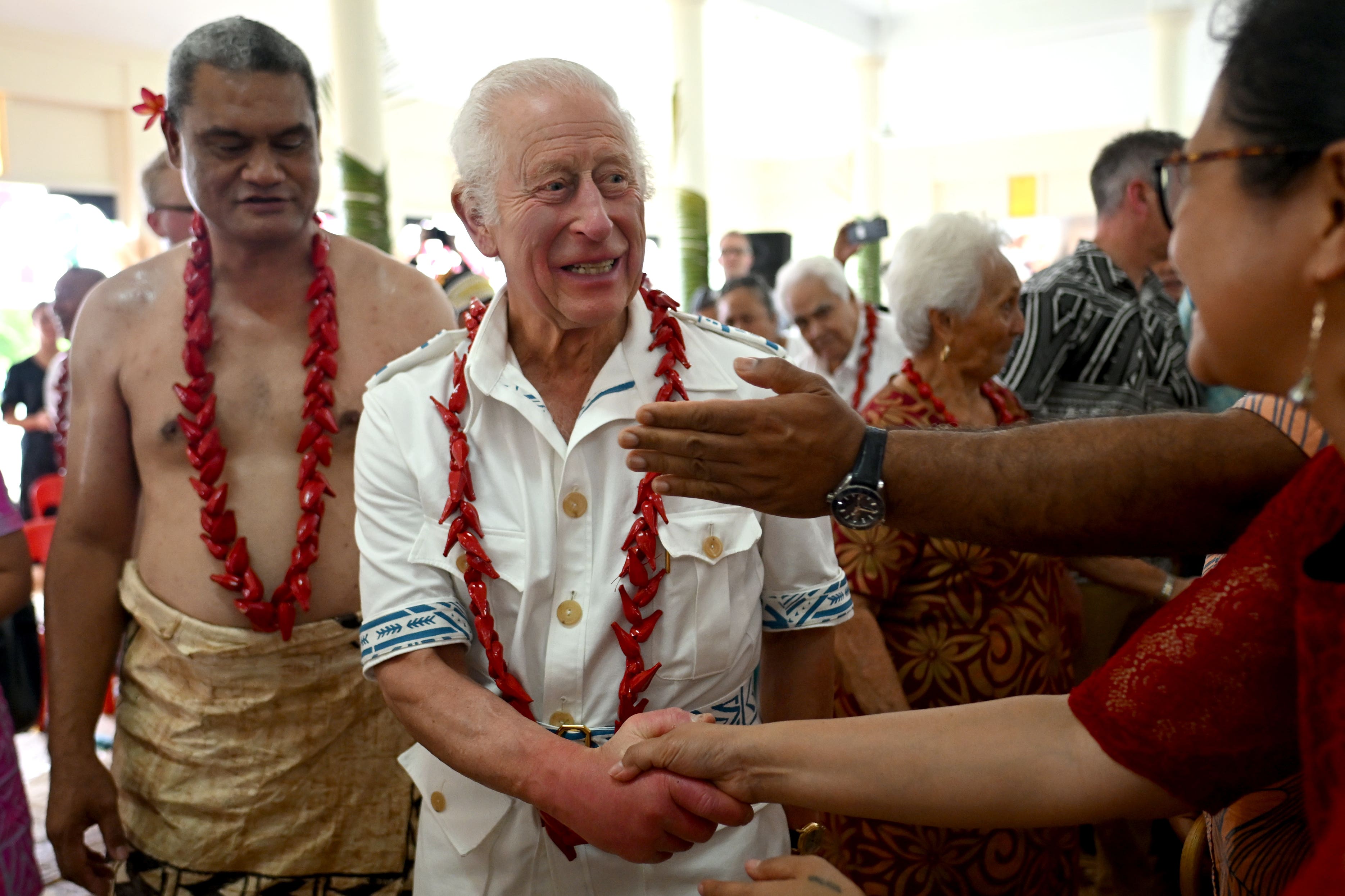 King Charles III is greeted as he arrives for a traditional ceremonial welcome during a visit to Moata’a Church Hall in Samoa (Victoria Jones/PA)