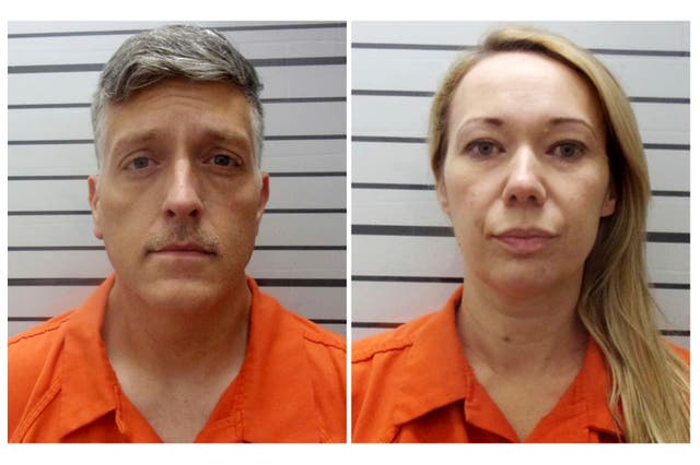 <p>This combination of booking photos provided by the Muskogee County, Okla., Sheriff's Office shows Jon Hallford, left, and Carie Hallford, owners of Return to Nature Funeral Home</p>