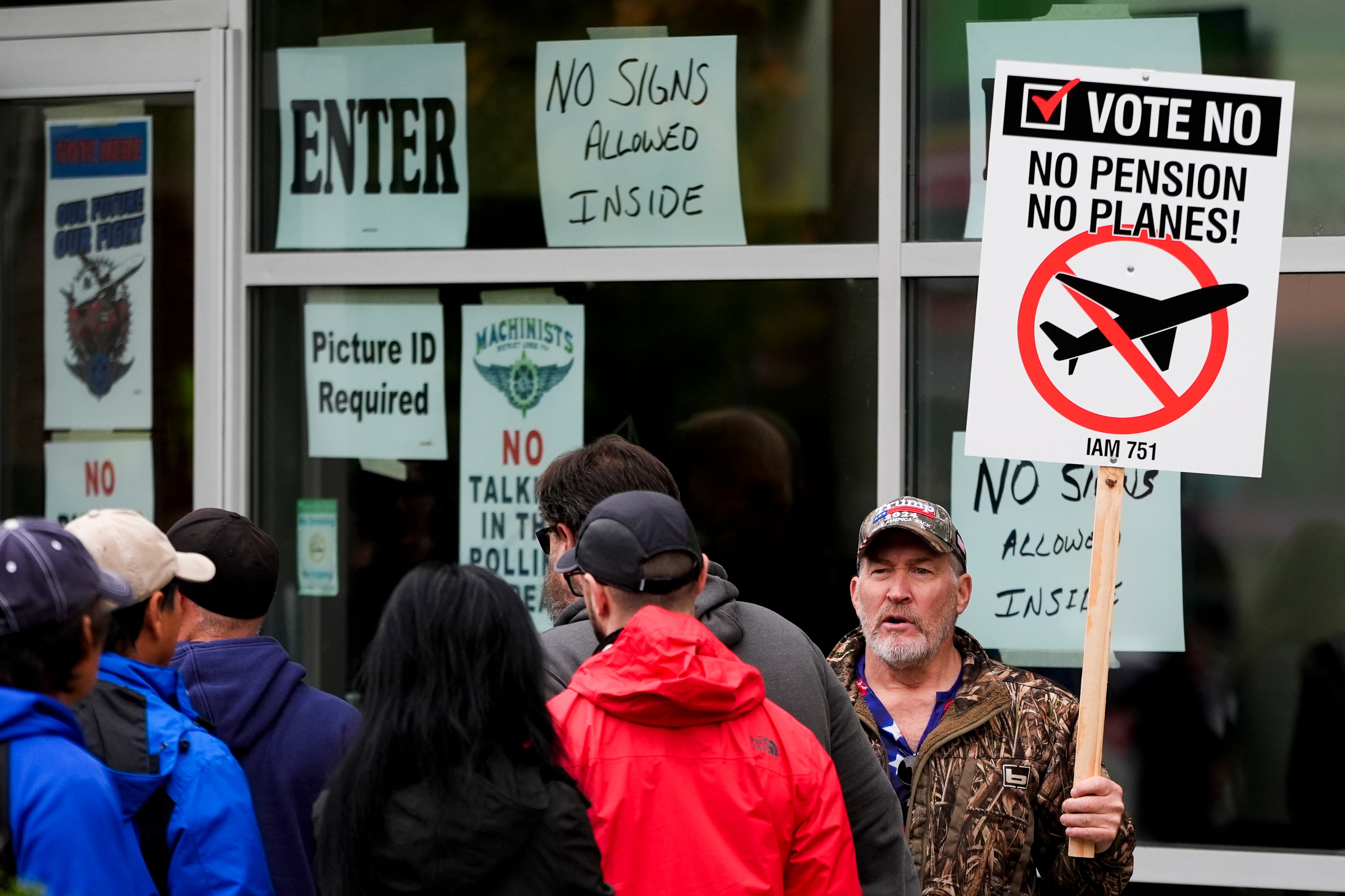 Bartley Stokes Sr, who has worked for Boeing for 46 years, encourages fellow employees on strike to vote no on a new contract offer from the company at a voting location in Everett, Washington, on 23 October 2024