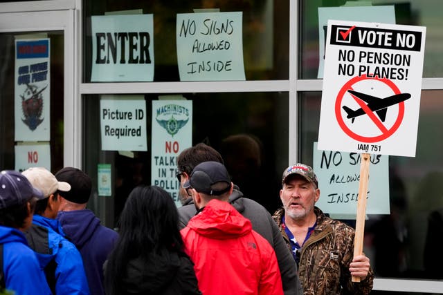 <p>Bartley Stokes Sr, who has worked for Boeing for 46 years, encourages fellow employees on strike to vote no on a new contract offer from the company at a voting location in Everett, Washington, on 23 October 2024</p>