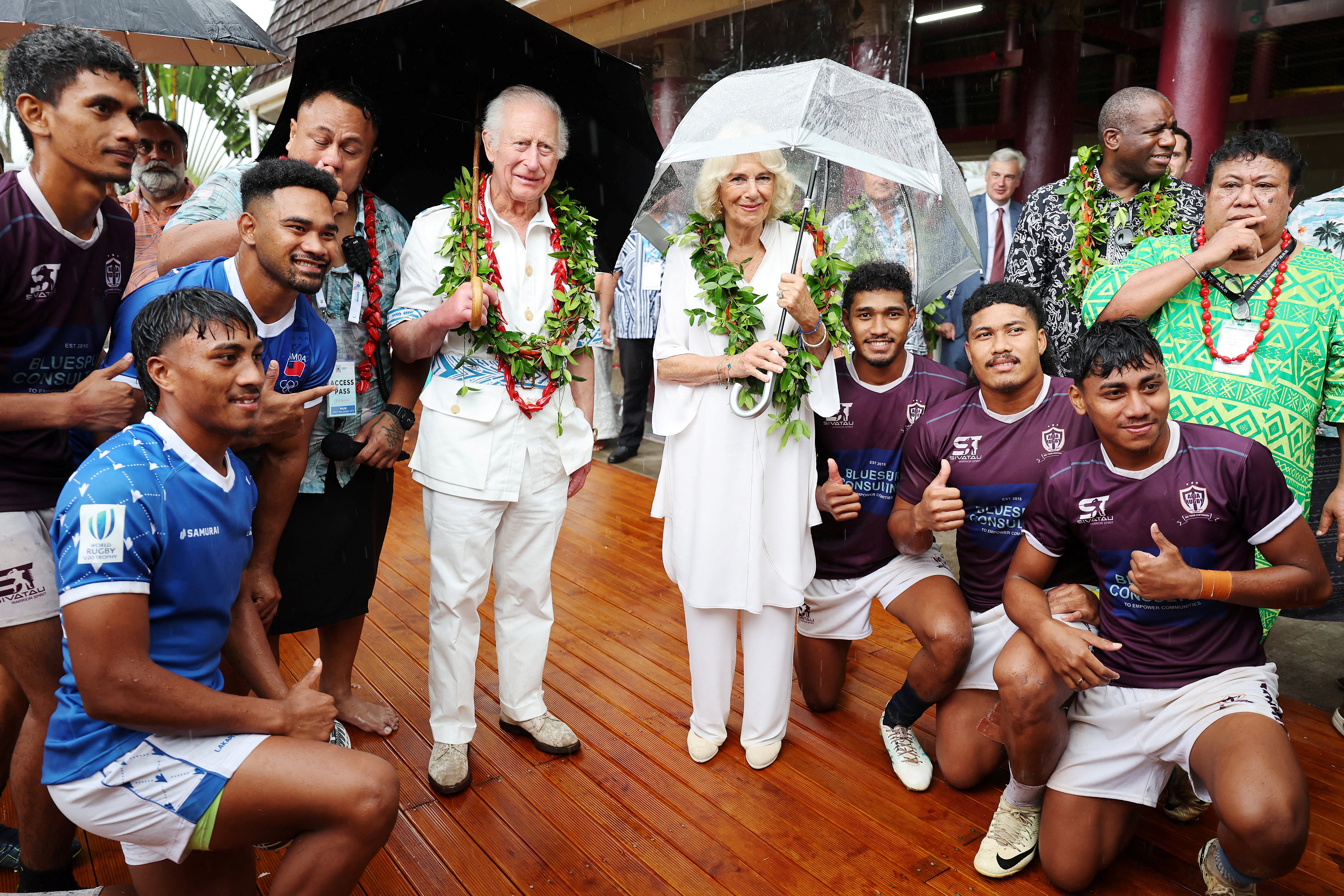 The couple pose with rugby union players