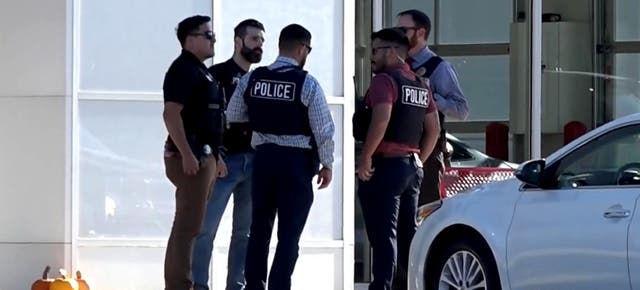 <p>Police on the scene at the car dealership in DeKalb, Illinois  </p>