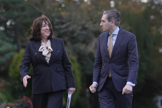 US Ambassador to Ireland Claire D Cronin and Taoiseach Simon Harris arriving for the US-Ireland Economic Summit (Brian Lawless/PA)