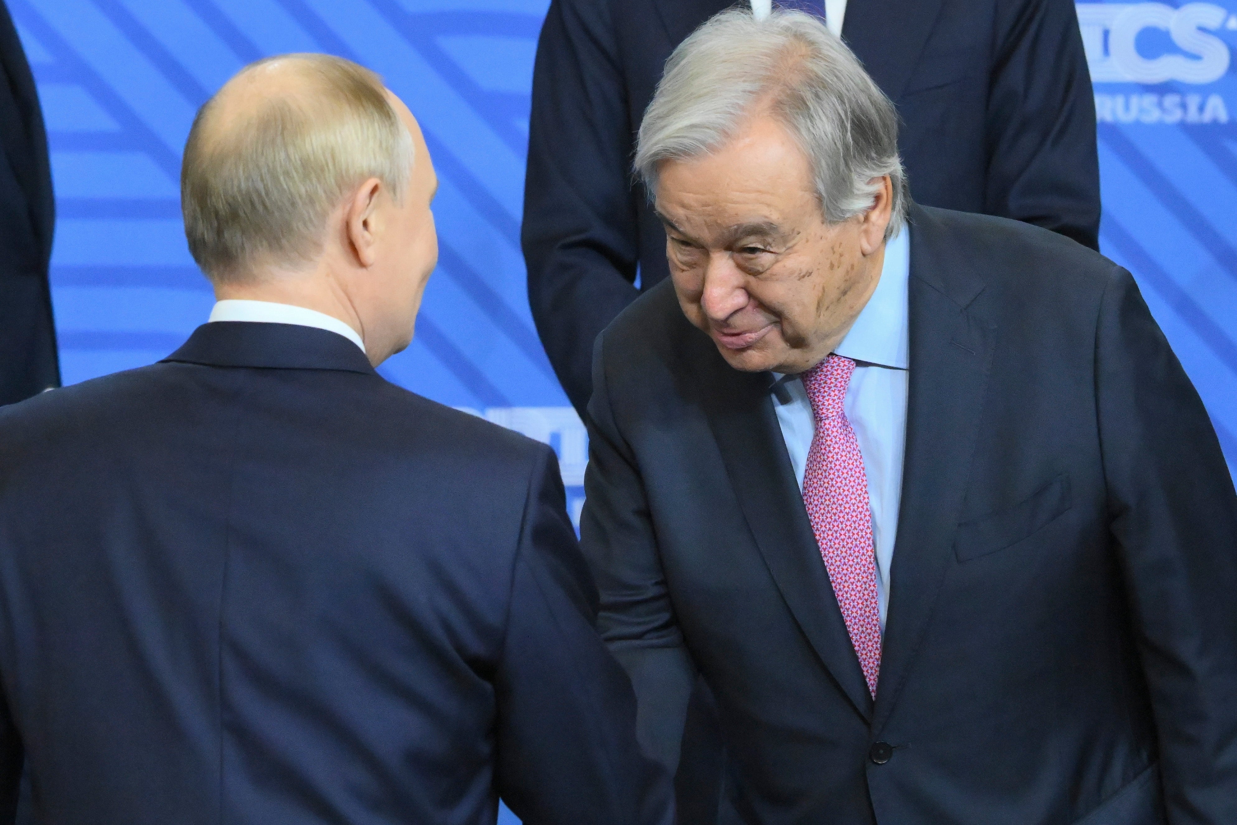 Russian President Vladimir Putin, left, and United Nations Secretary-General Antonio Guterres shake hands during family photo ceremony prior to Outreach/BRICS Plus format session on the sidelines of the BRICS summit in Kazan, Russia