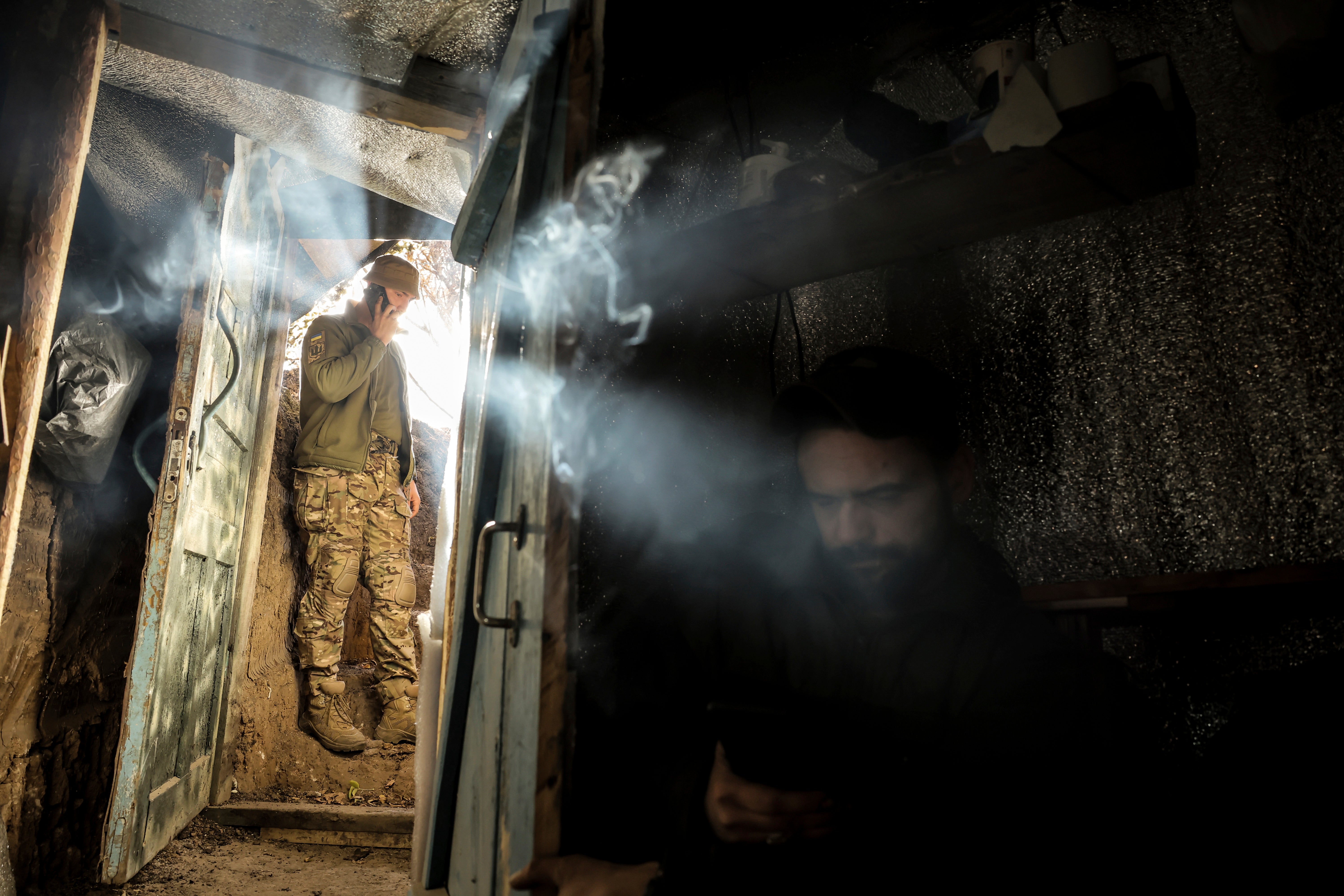 A servicemen of the 24th Mechanised Brigade rest on their position in Chasiv Yar