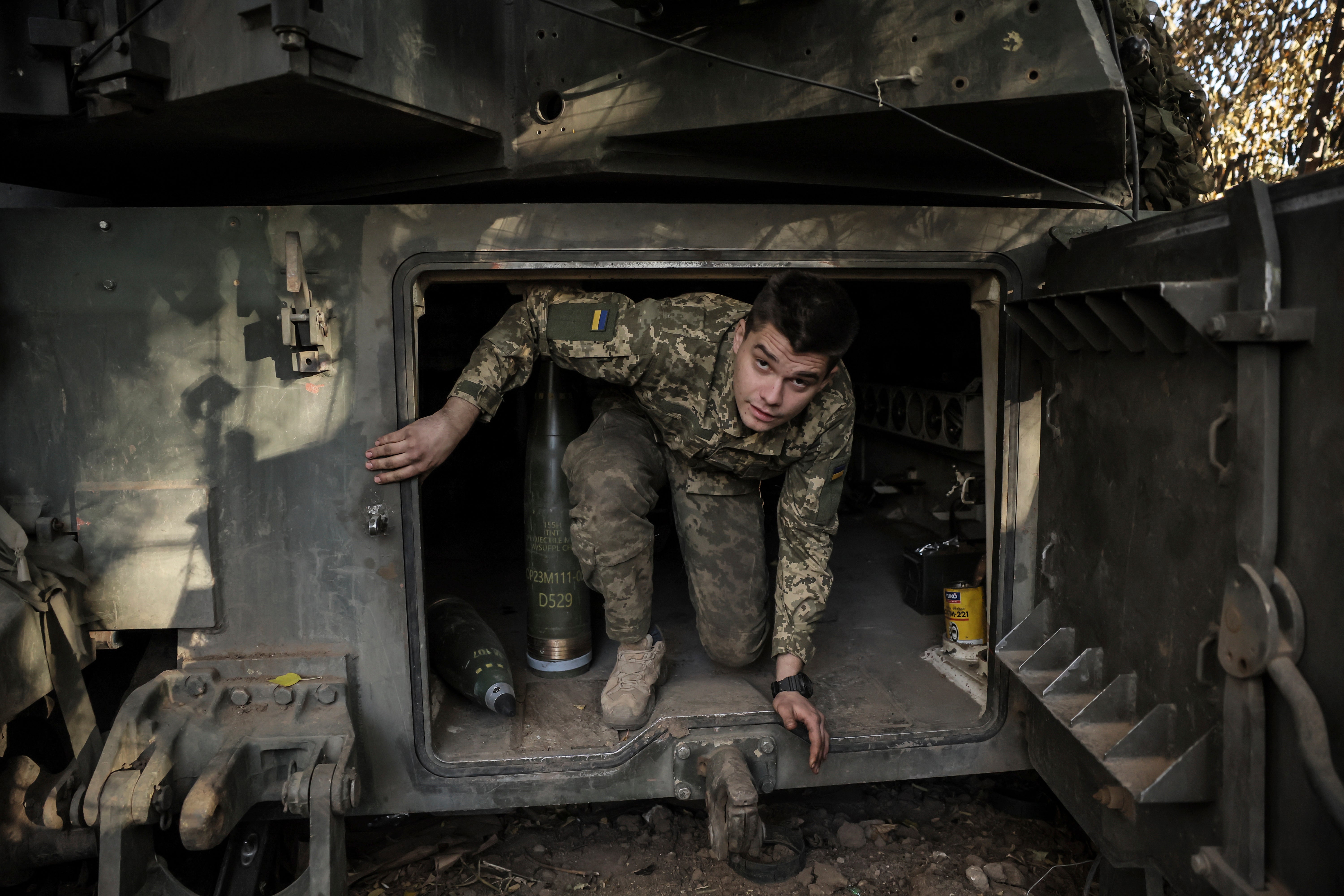 In this photo provided by Ukraine’s 24th Mechanised Brigade press service, a Ukrainian soldier is seen inside a M109 self-propelled howitzer on the frontline on their position in Chasiv Yar, Donetsk region, eastern Ukraine