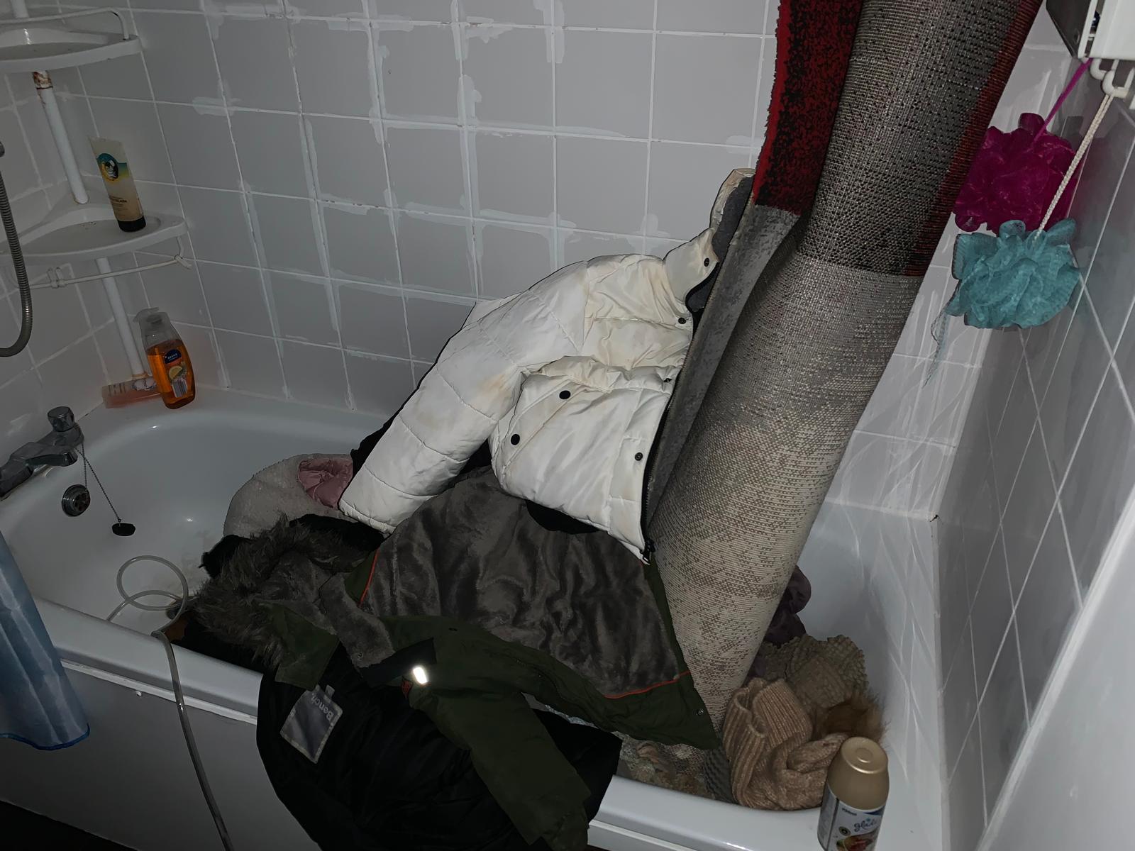 The family tried to salvage some of their belongings by putting them in the bath after their flat was flooded