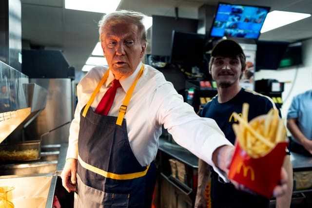 <p>Donald Trump works behind the counter during a campaign event at McDonald's restaurant on October 20, 2024 in Feasterville-Trevose, Pennsylvania</p>