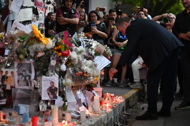 <p>Geoff Payne, right, the father of former One Direction singer Liam Payne, visits a memorial outside the Casa Sur Hotel where the British pop singer fell to his death from a hotel balcony, in Buenos Aires, Argentina, Friday, 18 Oct 2024</p>