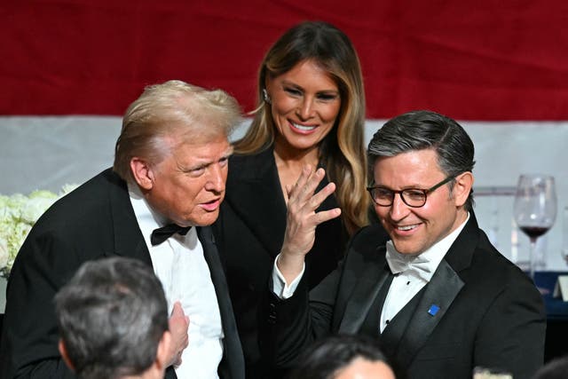 <p> Republican presidential candidate Donald Trump (L) chats with Speaker of the House Mike Johnson (R) alongside former first lady Melania Trump during the 79th Annual Alfred E. Smith Memorial Foundation Dinner in New York City. Trump is again pitching no federal taxes, as GOP leaders in Congress prepare their own tax plans </p>