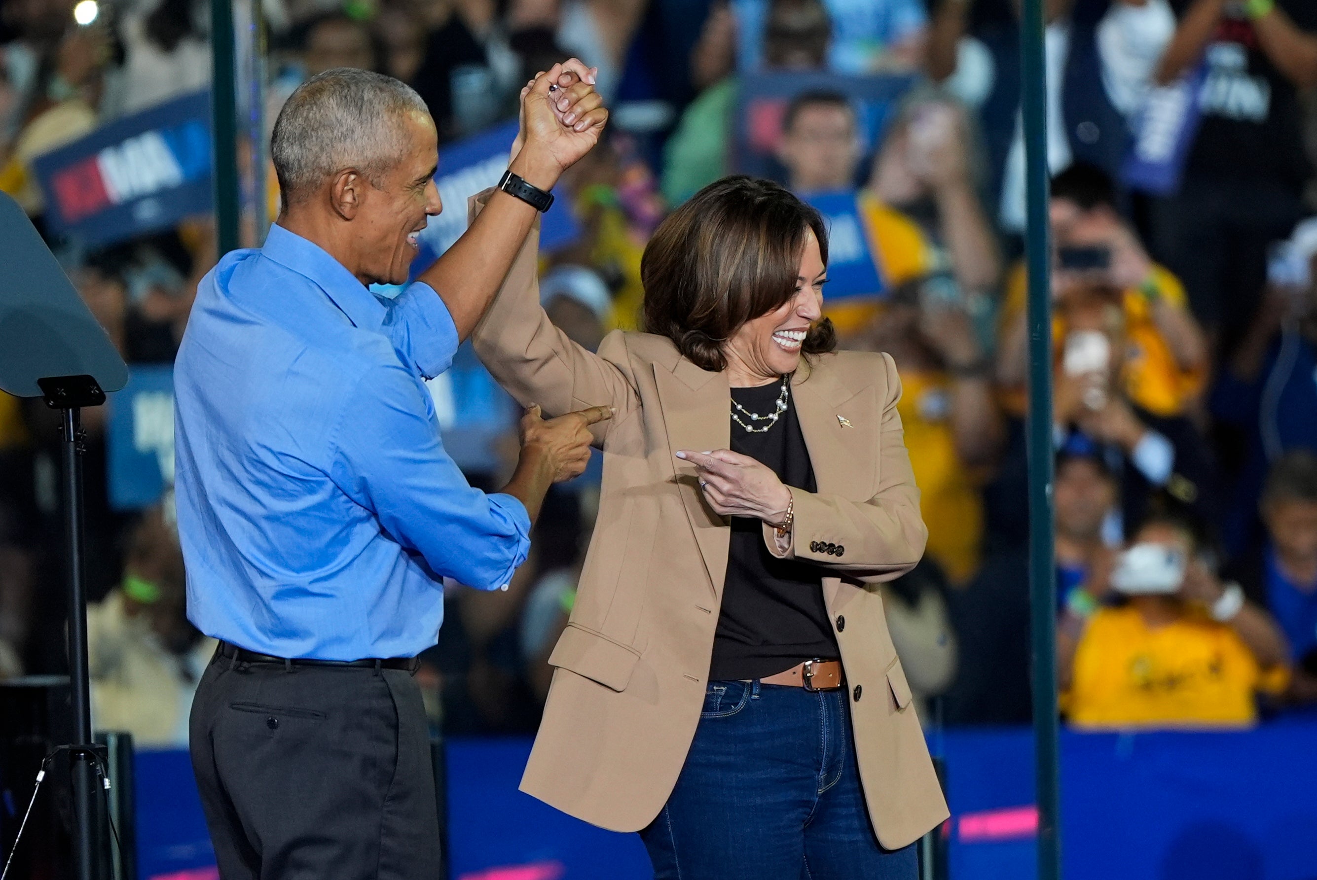 Former President Barack Obama gestures to Democratic presidential nominee Vice President Kamala Harris after introducing her to speak during a campaign rally for Harris on Thursday, Oct. 24, 2024, in Clarkston, Georgia