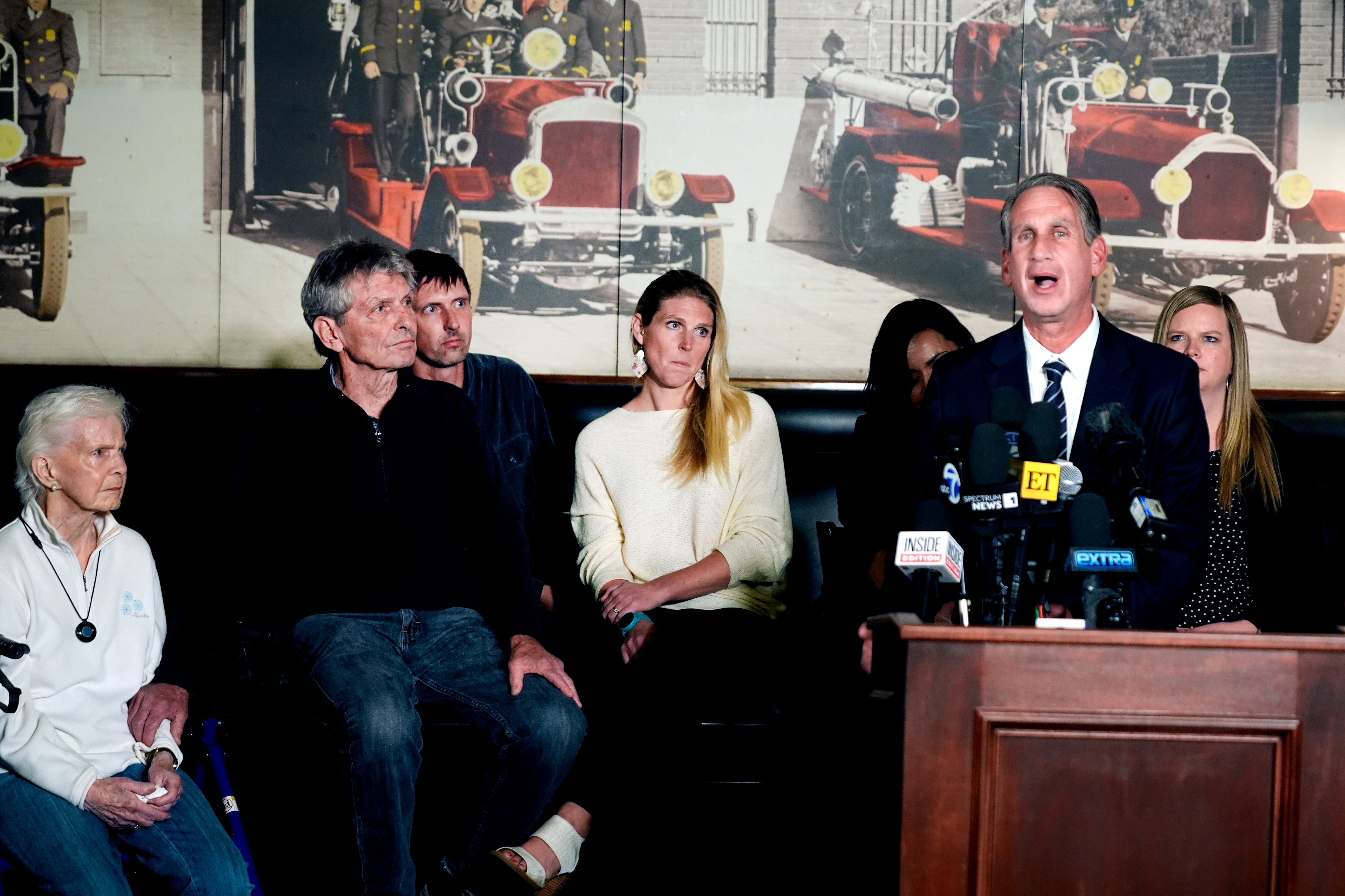 Menendez family attorney Bryan Freedman surrounded by family members as he talks during a news conference on Thursday