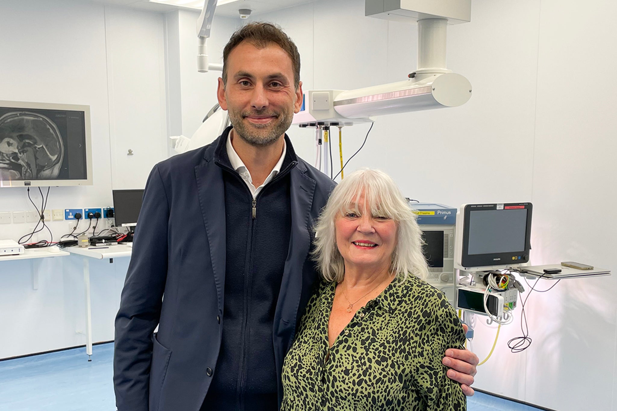 Mr Anastasios Giamouriadis, a consultant neurosurgeon at NHS Grampian, with patient Doreen Adams