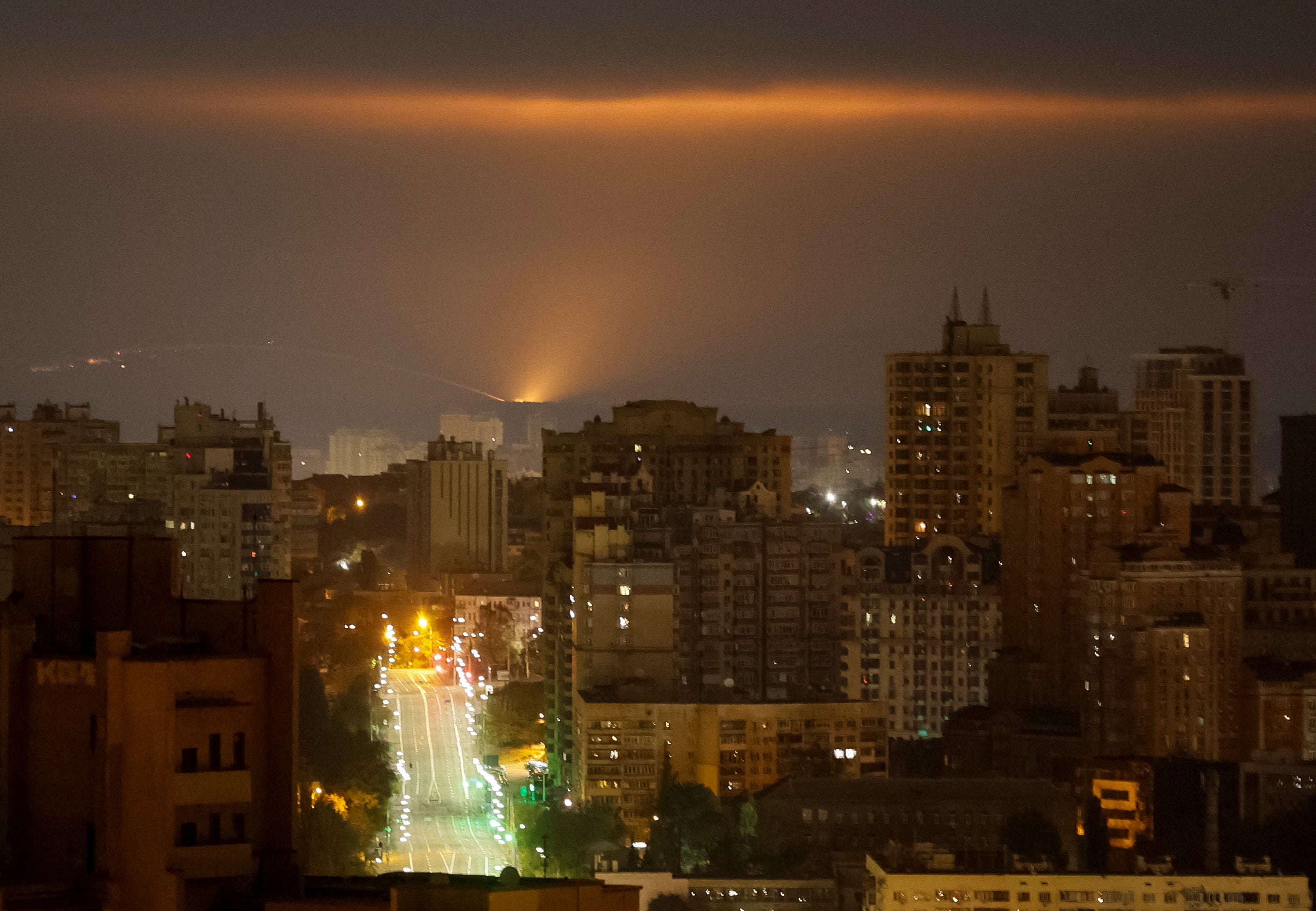 An explosion of a drone is seen in the sky over the city during a Russian drone strike in Kyiv, Ukraine