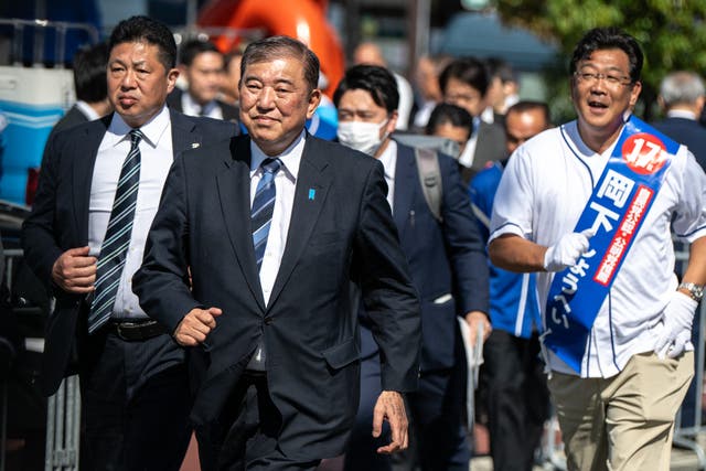 <p>Japan’s Shigeru Ishiba (second left) during an election campaign event in Osaka </p>