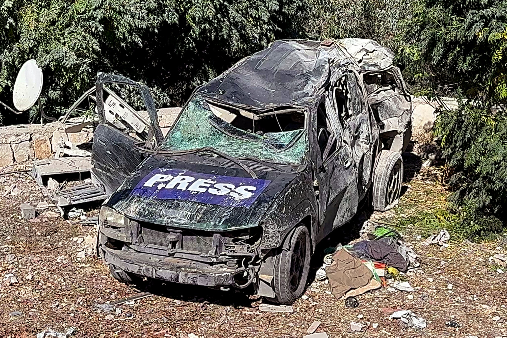 Pictures of the scene show destroyed cars marked with ‘Press’